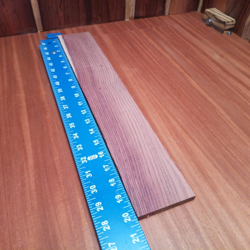 Honduran Rosewood Acoustic Rift Sawn Fingerboard Blank 0.4" X 3.3" X 20.2" - HRAFBR000243 3 Crafted from premium Honduran Rosewood, this fingerboards blank delivers unmatched warmth and rich tones. Perfect for luthiers looking to create exceptional instruments, its rift-sawn grain provides stunning aesthetic appeal along with phenomenal playability. Get ready to elevate your builds with this high-quality wood that musicians will love. Whether you’re crafting acoustic or electric guitars, this blank offers precision and character on every fretboard. It is a Honduran Rosewood Acoustic Rift Sawn fingerboard blank with dimensions of 20.2 x 3.3 x 0.4 inches.
