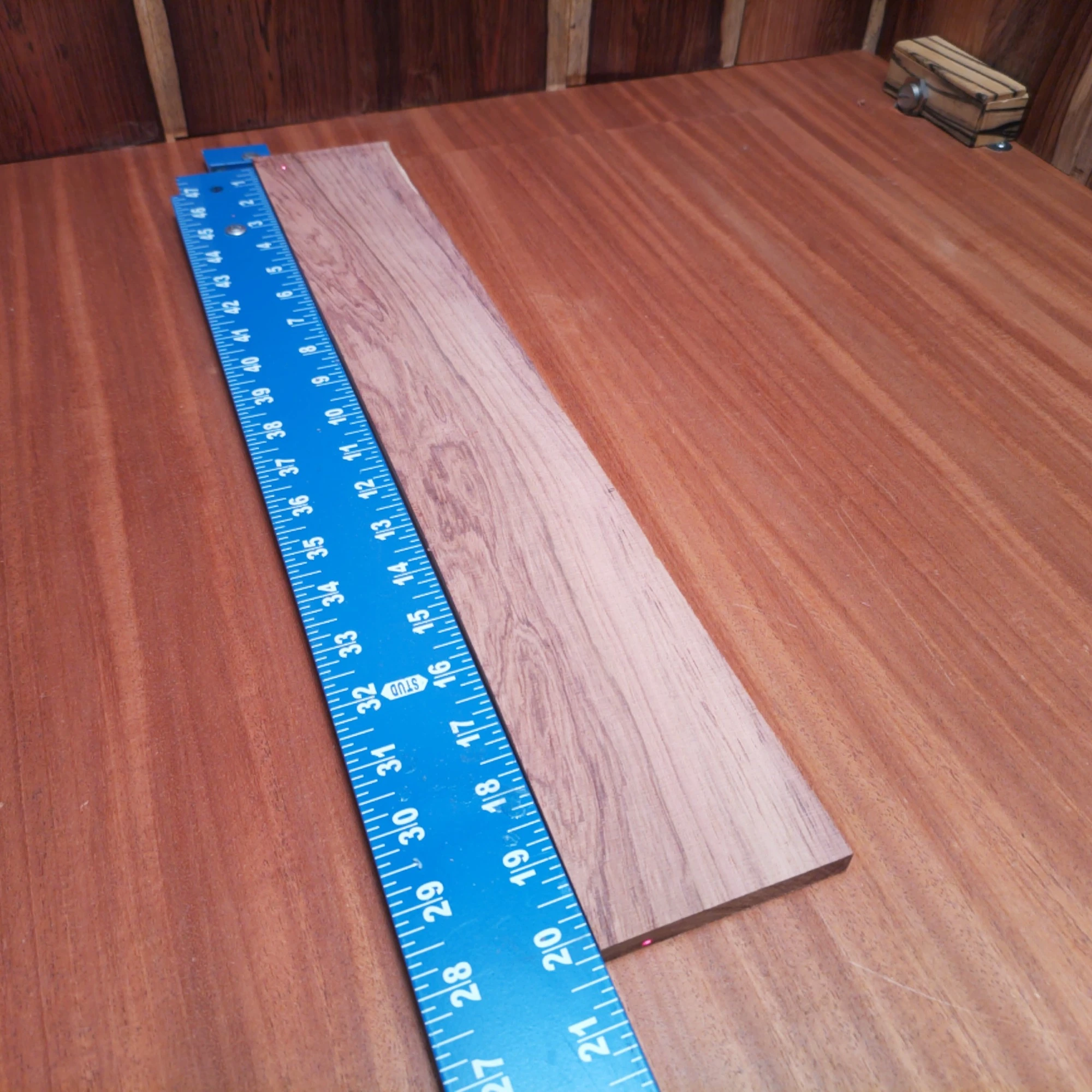 Honduran Rosewood Acoustic Rift Sawn Fingerboard Blank 0.4" X 3.1" X 20.2" - HRAFBR000247 1 This Honduran Rosewood acoustic blank is a superb choice for luthiers seeking durability and beauty. With rich tones and a stunning visual appeal, it enhances any musical instrument you create. Experience the rich sustain and clarity this exquisite blank brings to your guitar projects, allowing your craftsmanship to shine. Perfect for those who appreciate the blend of quality and performance in their builds. It is a Honduran Rosewood Acoustic Rift Sawn fingerboard blank with dimensions of 20.2 x 3.1 x 0.4 inches.