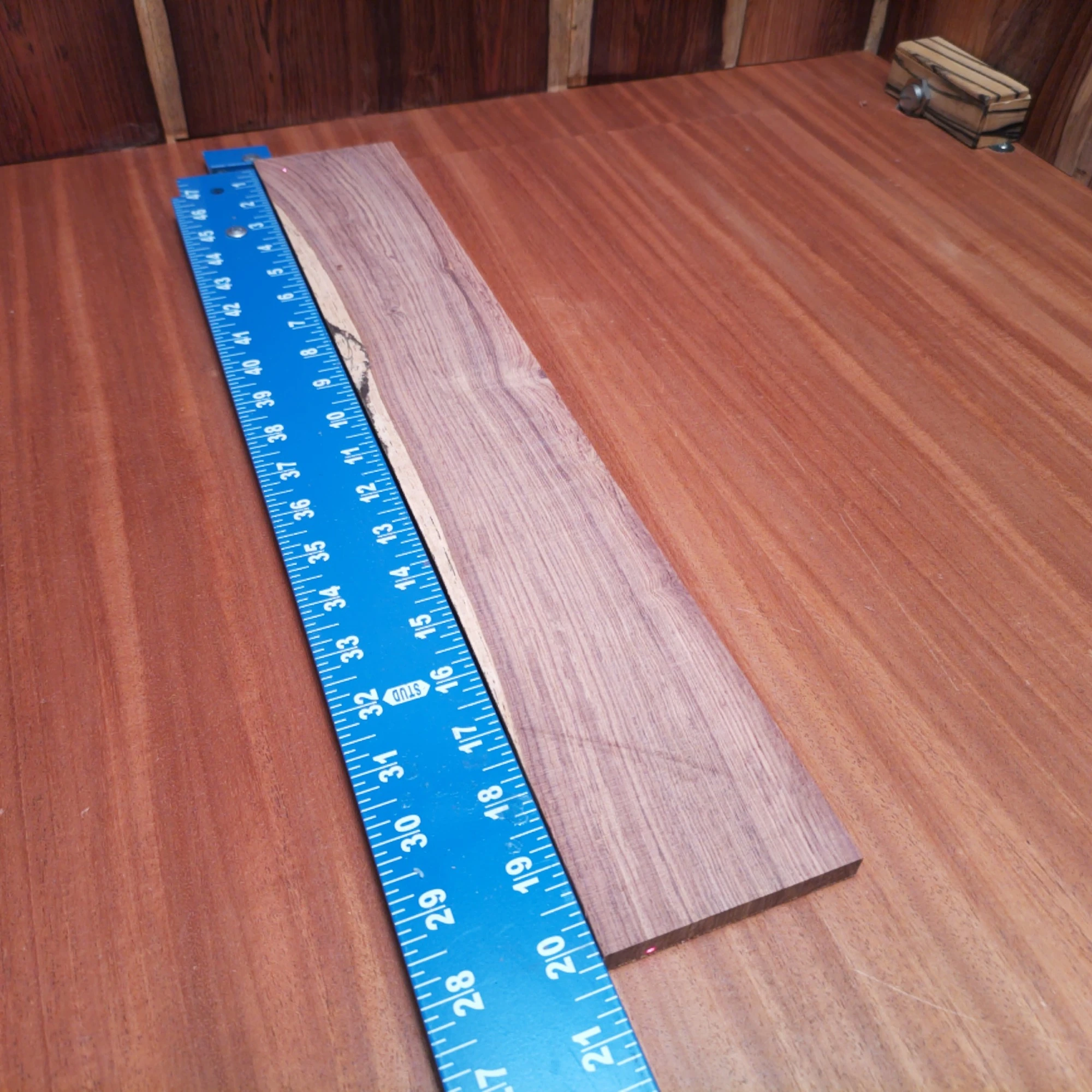 Honduran Rosewood Acoustic Rift Sawn Fingerboard Blank 0.4" X 3.3" X 20.1" - HRAFBR000248 1 Crafted from premium Honduran Rosewood, this acoustic fingerboard blank offers unparalleled resonance and durability. Perfectly suited for luthiers, it delivers a rich tone while enhancing your favorite stringed instrument's aesthetics. Its rift-sawn slices guarantee a sleek, straight grain that is not only visually appealing but also ensures stability for years of playing. Elevate your builds with this versatile and high-quality wood solution, designed for excellence in sound and playability. It is a Honduran Rosewood Acoustic Rift Sawn fingerboard blank with dimensions of 20.1 x 3.3 x 0.4 inches.