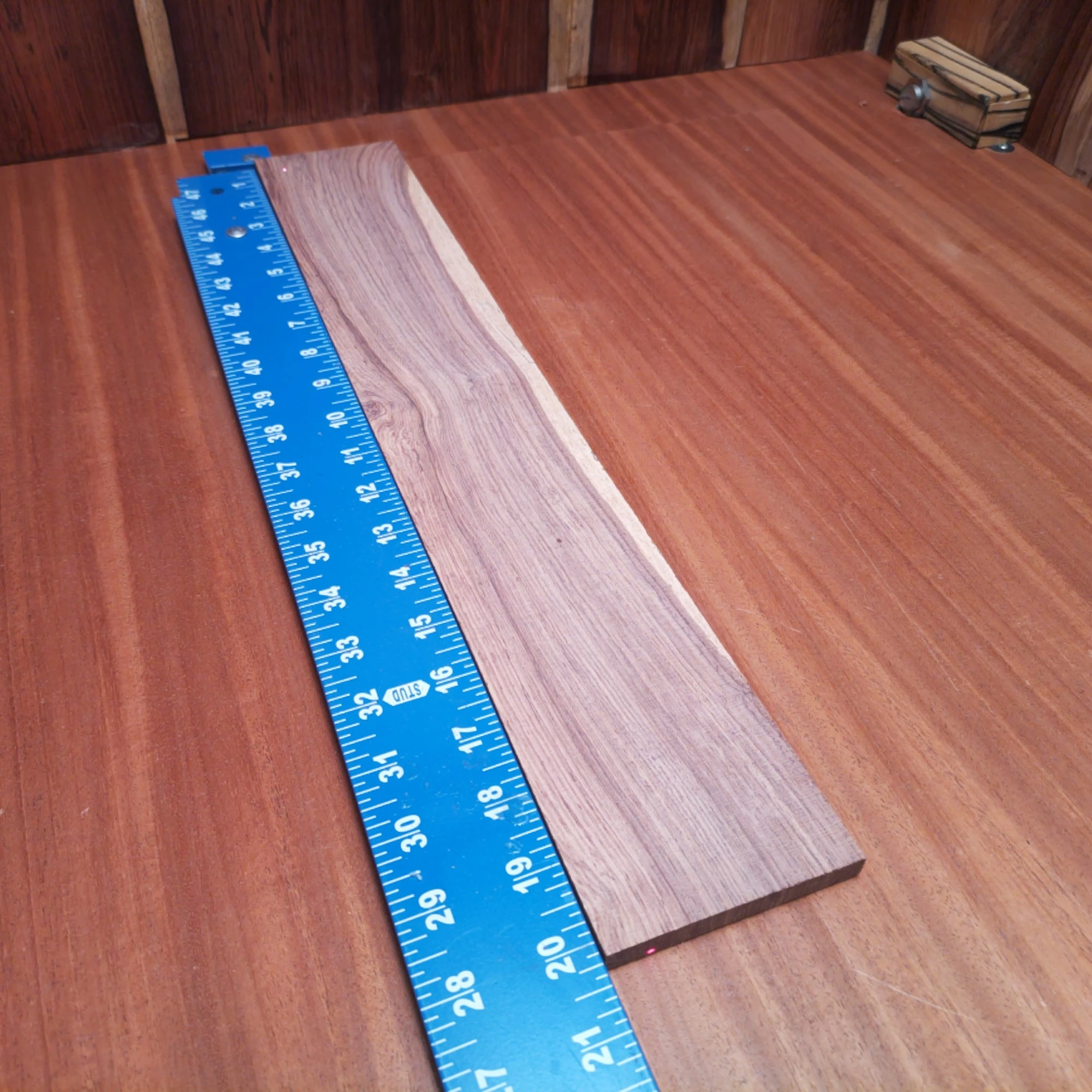 Honduran Rosewood Acoustic Rift Sawn Fingerboard Blank 0.4" X 3.3" X 20.1" - HRAFBR000248 2 Crafted from premium Honduran Rosewood, this acoustic fingerboard blank offers unparalleled resonance and durability. Perfectly suited for luthiers, it delivers a rich tone while enhancing your favorite stringed instrument's aesthetics. Its rift-sawn slices guarantee a sleek, straight grain that is not only visually appealing but also ensures stability for years of playing. Elevate your builds with this versatile and high-quality wood solution, designed for excellence in sound and playability. It is a Honduran Rosewood Acoustic Rift Sawn fingerboard blank with dimensions of 20.1 x 3.3 x 0.4 inches.