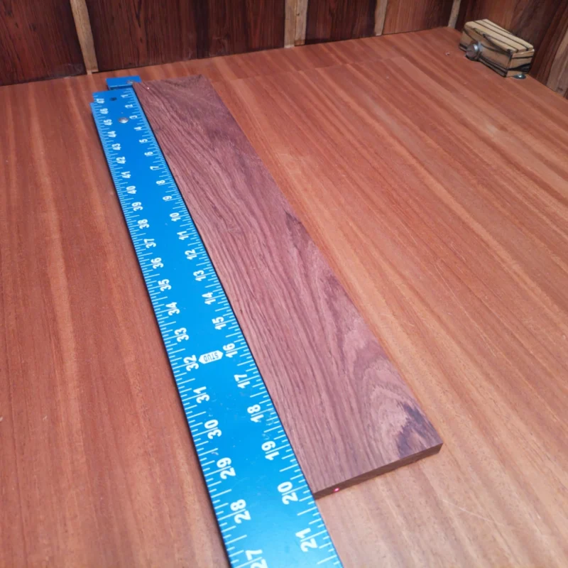 This Honduran Rosewood blank is perfect for building acoustic instruments. With its unique rift-sawn grain, it offers stunning aesthetics alongside excellent tonal qualities. Whether you're crafting a guitar or another string instrument, this wood provides the durability and resonate character needed for great sound. Elevate your artistry with this choice material that stands up to the rigors of luthier work while impressing musicians with its visual appeal and auditory charm. It is a Honduran Rosewood Acoustic Rift Sawn fingerboard blank with dimensions of 20.2 x 3.3 x 0.4 inches.