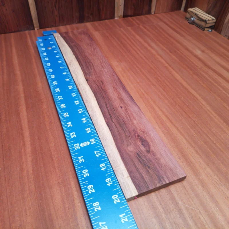 Fingerboard Blanks 61 Crafted from premium Honduran Rosewood, this fingerboard blank is ideal for luthiers seeking durability and stunning aesthetic appeal. Its rift-sawn design ensures better stability and resonance, making your instruments sing. Perfect for crafting superior acoustic guitars or custom projects, this blank is a must-have for professional and hobbyist luthiers alike. Elevate your guitar-making game with rich tones and a striking finish that only Honduran Rosewood can provide. It is a Honduran Rosewood Acoustic Rift Sawn fingerboard blank with dimensions of 20.2 x 3.7 x 0.3 inches.