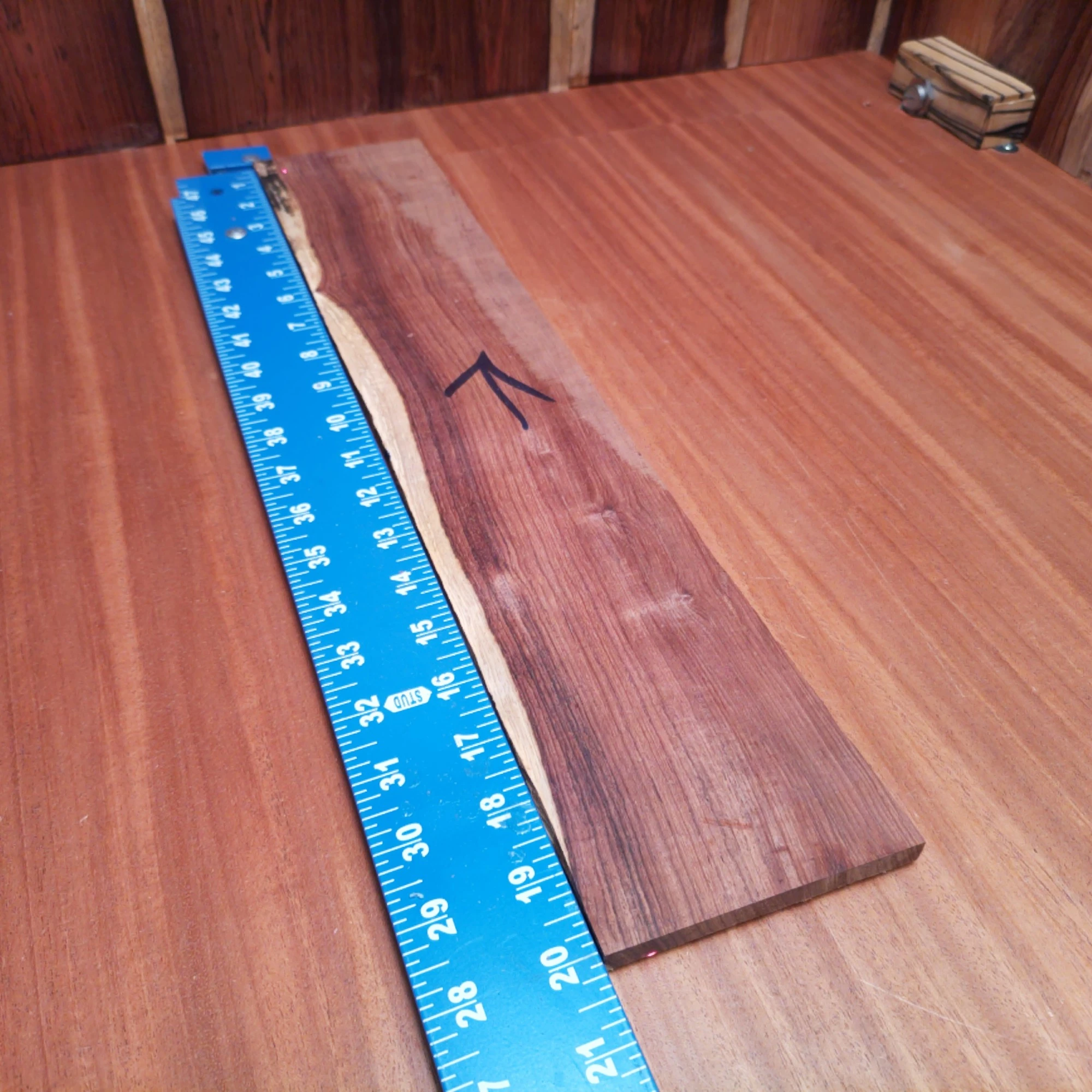 Honduran Rosewood Acoustic Rift Sawn Fingerboard Blank 0.4" X 3.9" X 20.0" - HRAFBR000251 1 Crafted from stunning Honduran Rosewood, this fingerboard blank offers rich tones and durability. Measuring 0.4" x 3.9" x 20.0", it's perfect for luthiers looking to enhance their acoustic creations. Its rift-sawn cut provides a smooth, attractive surface that resonates beautifully, allowing you to unleash your creativity. Elevate your guitar making with this premium quality, fine-grained blank that promises impeccable results. It is a Honduran Rosewood Acoustic Rift Sawn fingerboard blank with dimensions of 20.0 x 3.9 x 0.4 inches.