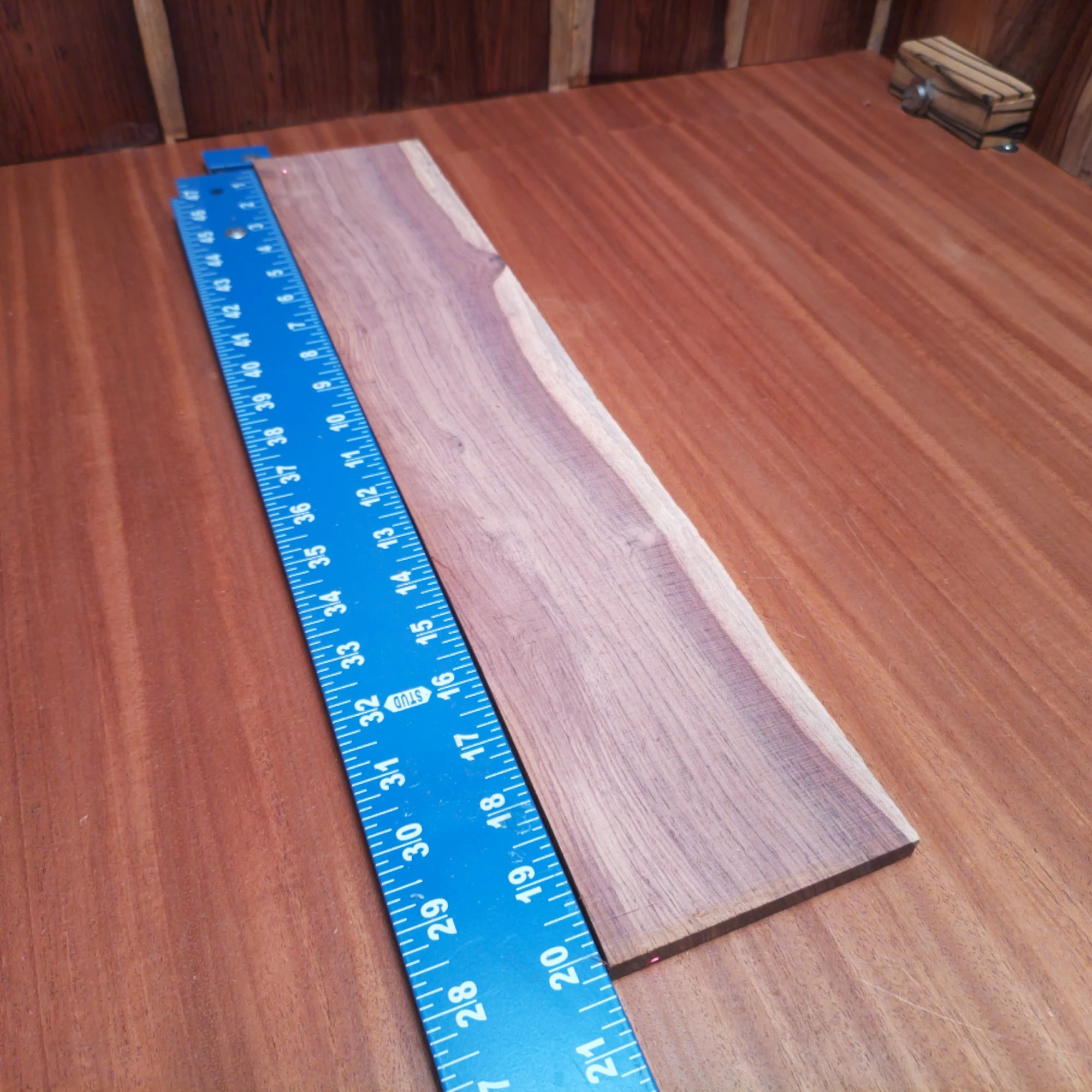 Honduran Rosewood Acoustic Rift Sawn Fingerboard Blank 0.4" X 3.9" X 20.0" - HRAFBR000251 2 Crafted from stunning Honduran Rosewood, this fingerboard blank offers rich tones and durability. Measuring 0.4" x 3.9" x 20.0", it's perfect for luthiers looking to enhance their acoustic creations. Its rift-sawn cut provides a smooth, attractive surface that resonates beautifully, allowing you to unleash your creativity. Elevate your guitar making with this premium quality, fine-grained blank that promises impeccable results. It is a Honduran Rosewood Acoustic Rift Sawn fingerboard blank with dimensions of 20.0 x 3.9 x 0.4 inches.