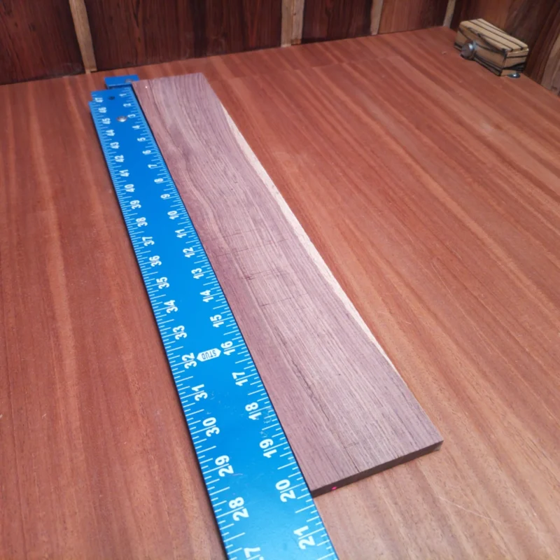 Unlock the potential of your next acoustic masterpiece with this stunning Honduran Rosewood blank. Perfectly rift sawn for optimal grain alignment, it offers superior resonance and tonal clarity. Ideal for luthiers looking to create rich, warm sound profiles, this blank will elevate your craft to a new level. Bring your guitar projects to life with the beauty and durability of premium rosewood. It is a Honduran Rosewood Acoustic Rift Sawn fingerboard blank with dimensions of 20.1 x 3.3 x 0.4 inches.