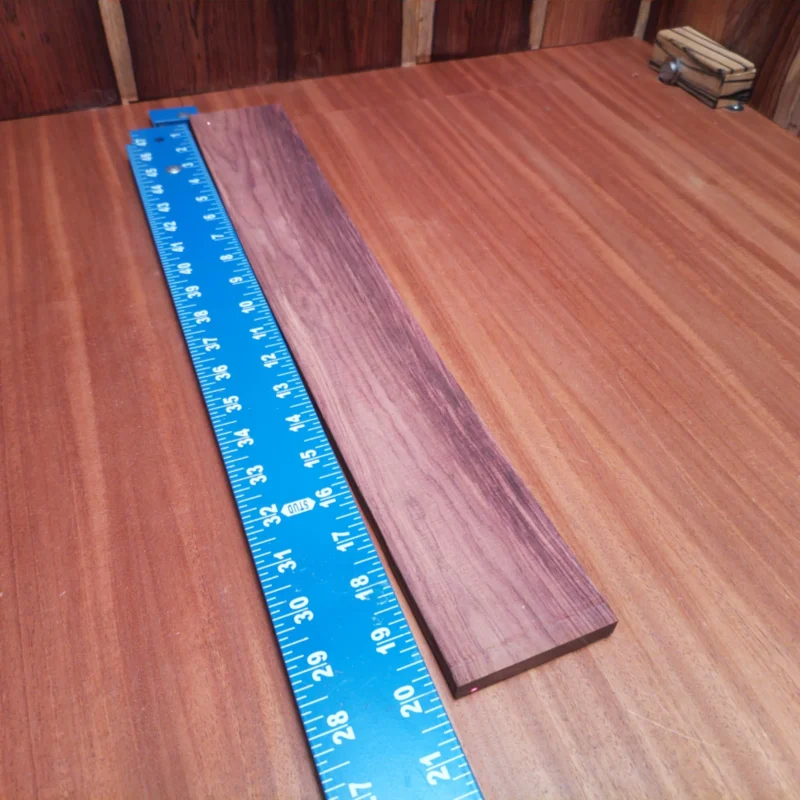 Elevate your next project with our Honduran Rosewood blank, perfect for crafting stunning acoustic guitars. This rift sawn masterpiece brings the warm tone and striking aesthetic that luthiers crave. Ideal for intricate designs, it ensures a rich sound quality that every musician will appreciate. Get ready to create high-quality instruments that deliver both beauty and performance! It is a Honduran Rosewood Acoustic Rift Sawn fingerboard blank with dimensions of 20.0 x 2.9 x 0.4 inches.