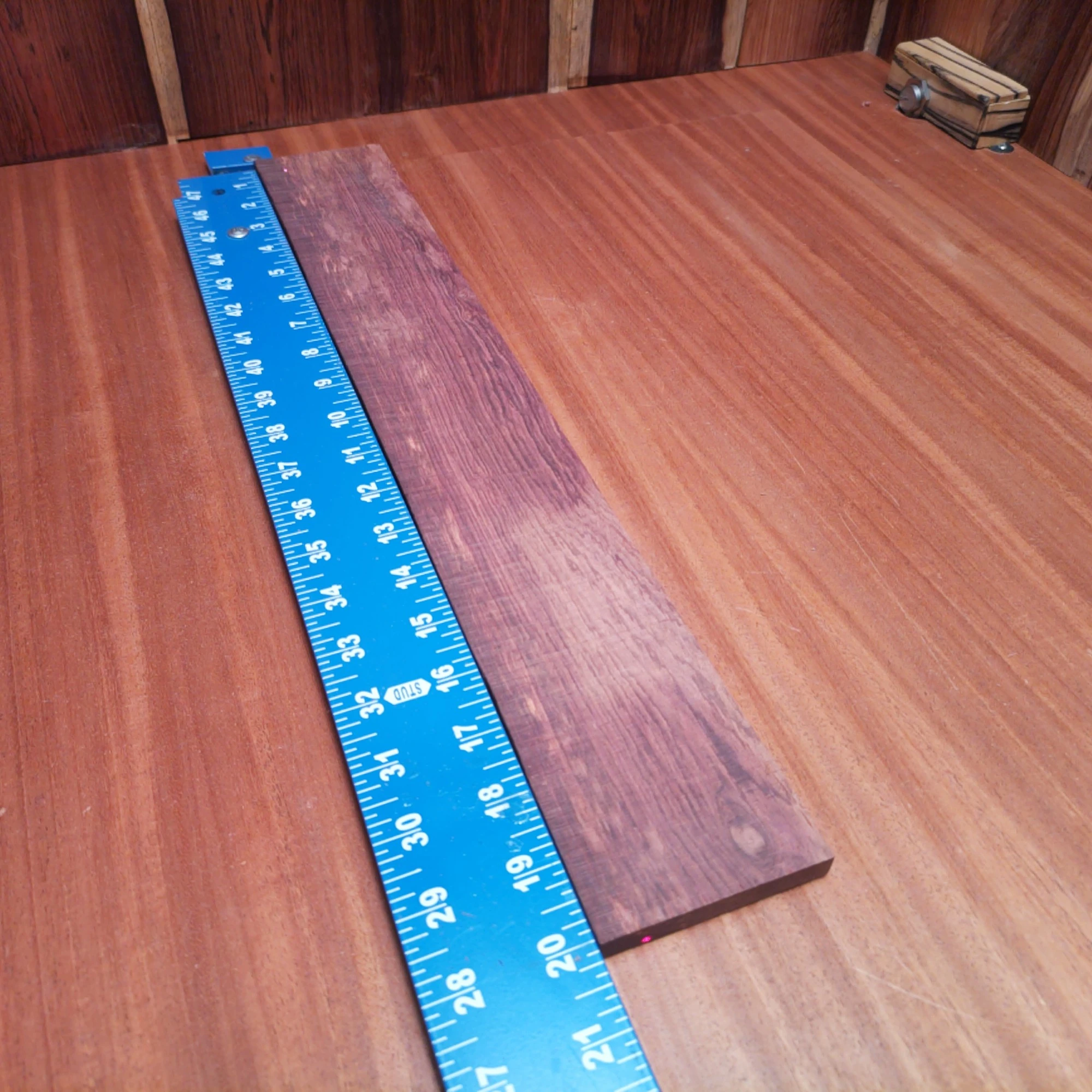 Honduran Rosewood Acoustic Rift Sawn Fingerboard Blank 0.4" X 2.9" X 20.1" - HRAFBR000265 1 Unlock your creativity with this Honduran Rosewood fingerboard blank, perfect for luthiers. Its beautiful grain patterns and rich tones make it an excellent choice for acoustic instruments, ensuring both durability and a vibrant resonance. Ideal for crafting high-quality fingerboards that enhance playability, this blank is a must-have for any serious luthier. Elevate your builds to the next level with this premium hardwood, guaranteeing your clients the ultimate sound experience. It is a Honduran Rosewood Acoustic Rift Sawn fingerboard blank with dimensions of 20.1 x 2.9 x 0.4 inches.