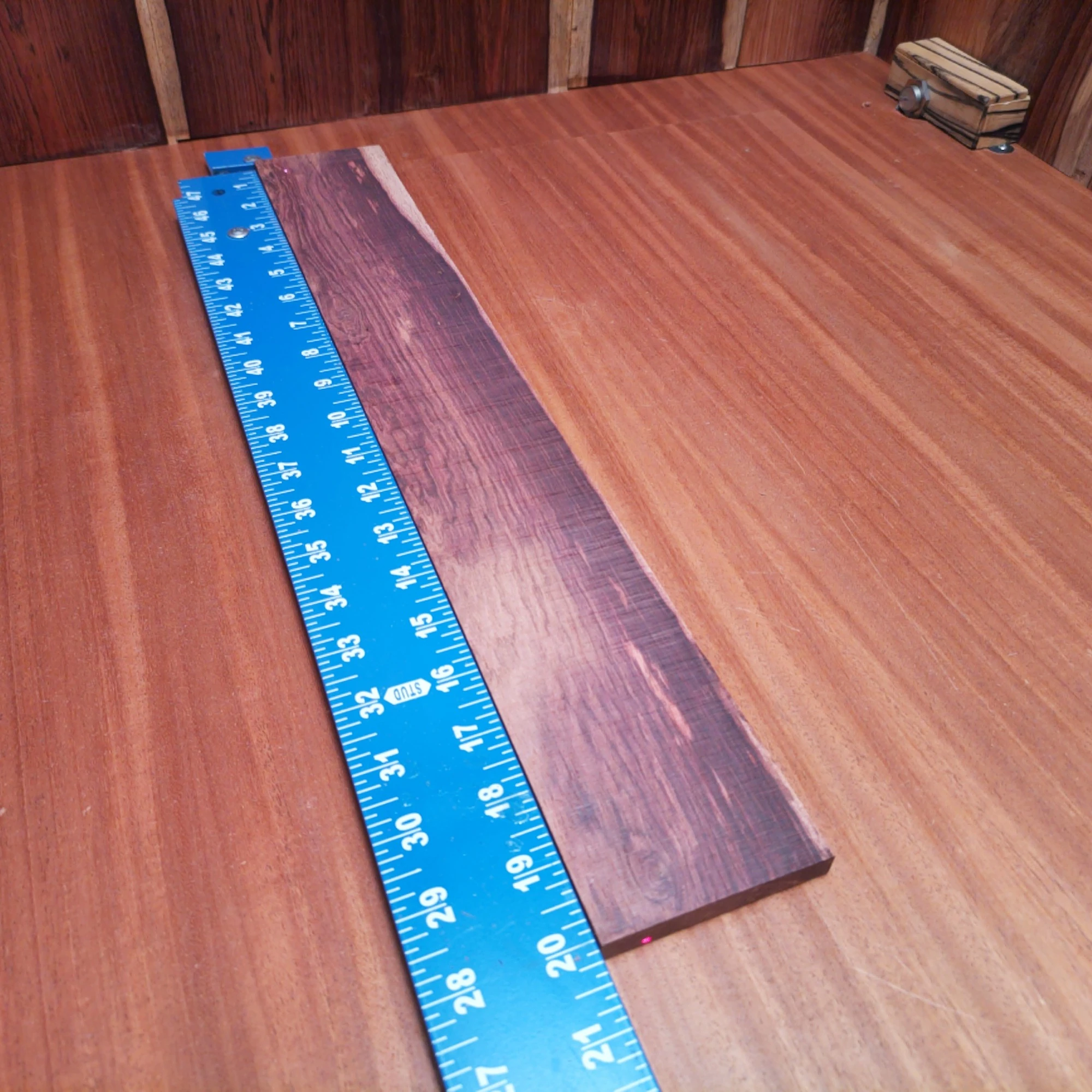 Honduran Rosewood Acoustic Rift Sawn Fingerboard Blank 0.4" X 2.9" X 20.1" - HRAFBR000265 2 Unlock your creativity with this Honduran Rosewood fingerboard blank, perfect for luthiers. Its beautiful grain patterns and rich tones make it an excellent choice for acoustic instruments, ensuring both durability and a vibrant resonance. Ideal for crafting high-quality fingerboards that enhance playability, this blank is a must-have for any serious luthier. Elevate your builds to the next level with this premium hardwood, guaranteeing your clients the ultimate sound experience. It is a Honduran Rosewood Acoustic Rift Sawn fingerboard blank with dimensions of 20.1 x 2.9 x 0.4 inches.
