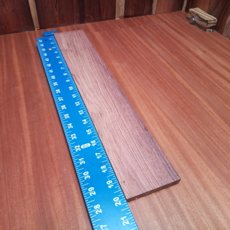 Elevate your luthiery game with this Honduran Rosewood blank, engineered for superior acoustic performance. The rich tonewoods deliver a warm, resonant sound that's perfect for crafting stunning instruments. With its beautiful grain and robust structure, this blank not only looks fantastic but also ensures durability and exceptional playability. Ideal for guitars and other string instruments, this blank is your go-to for achieving professional quality with minimal effort. It is a Honduran Rosewood Acoustic Rift Sawn fingerboard blank with dimensions of 20.1 x 3.2 x 0.4 inches.