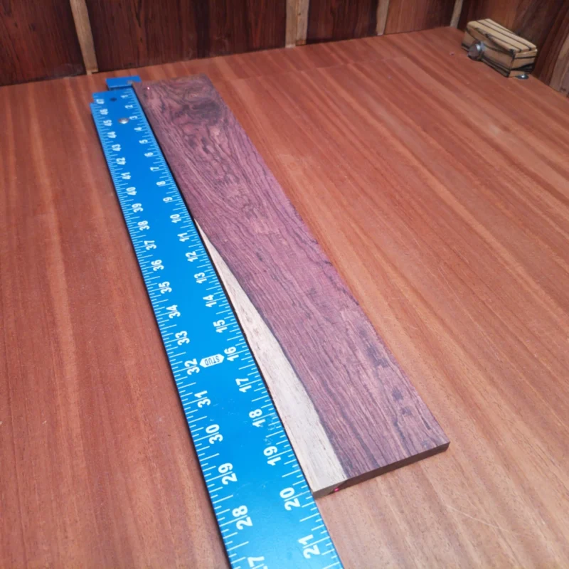 Enhance your guitar-building journey with our premium Honduran Rosewood blank. Perfectly rift sawn, this sturdy piece provides rich tonal qualities that enhance sound projection and resonance. Tailored for luthiers who prioritize quality in their instrument projects, it promises durability and beauty in every strum. Whether crafting acoustic masterpieces or unique custom designs, this fingerboard blank is your ideal companion for achieving perfect playability and tone. It is a Honduran Rosewood Acoustic Rift Sawn fingerboard blank with dimensions of 20.1 x 3.3 x 0.4 inches.