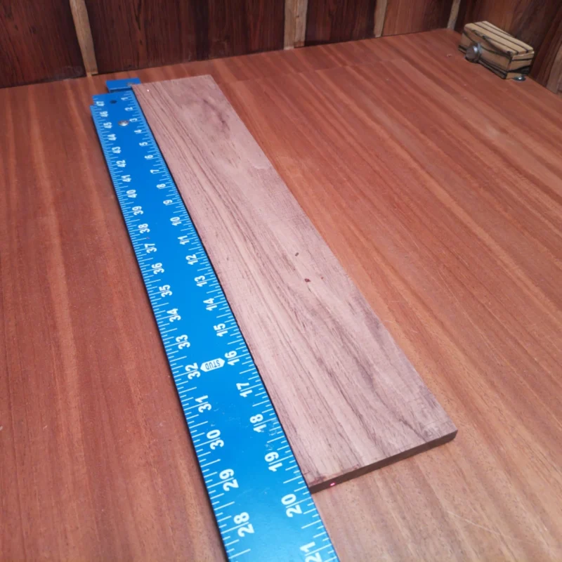 Honduran Rosewood Acoustic Rift Sawn Fingerboard Blank 0.4" X 3.6" X 19.8" - HRAFBR000271 3 Unlock your musical potential with this Honduran Rosewood fingerboard blank. Ideal for luthiers, its beautiful rift-sawn cuts enhance tonal quality and playability. Whether you're crafting a new guitar or giving life to a vintage piece, the naturally rich, resonant sound of this rosewood will elevate your instrument's performance. Dive into your next project and enjoy the craftsmanship that comes with this premium quality wood. It is a Honduran Rosewood Acoustic Rift Sawn fingerboard blank with dimensions of 19.8 x 3.6 x 0.4 inches.