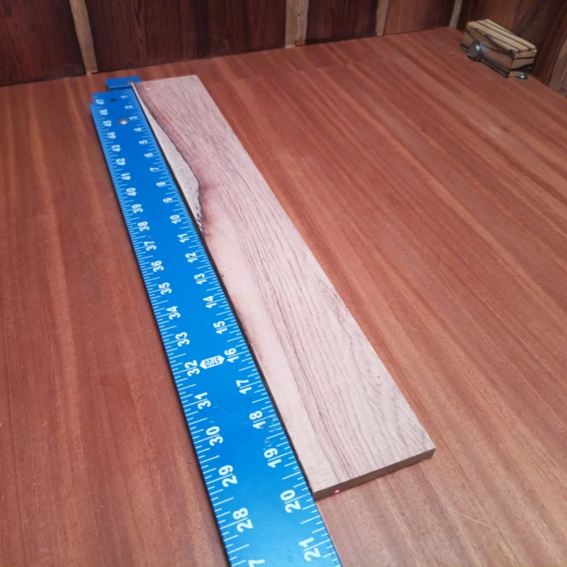 Elevate your luthier projects with our Honduran Rosewood Acoustic Rift Sawn fingerboard blank. This high-quality wood boasts rich tones and a stunning grain pattern, perfect for crafting the ultimate guitar. Its durable nature and smooth texture ensure excellent playability, making it a favorite among seasoned builders. Get ready to impress with quality and artistry combined! It is a Honduran Rosewood Acoustic Rift Sawn fingerboard blank with dimensions of 20.0 x 2.8 x 0.4 inches.