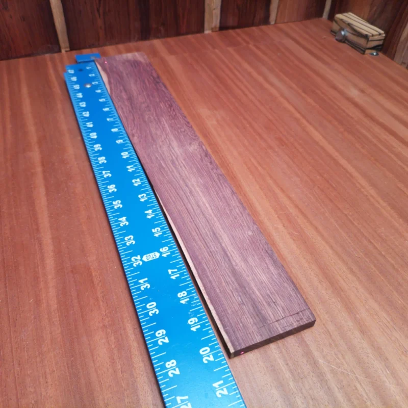 Elevate your acoustic instruments with this premium Honduran rosewood blank. Perfect for crafting guitars and other stringed instruments, its rich tonal qualities ensure a full-bodied sound. This rift sawn wood not only looks stunning but also adds durability and enhances resonance. Ideal for luthiers looking to create exceptional pieces that stand out and deliver superior performance. It is a Honduran Rosewood Acoustic Rift Sawn fingerboard blank with dimensions of 20.2 x 3.0 x 0.4 inches.