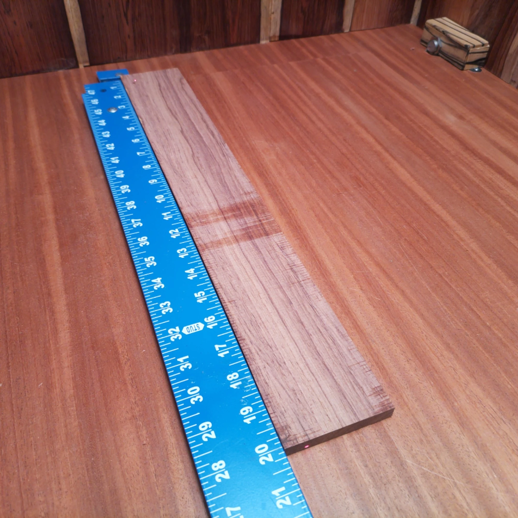 Honduran Rosewood Acoustic Rift Sawn Fingerboard Blank 0.4" X 2.8" X 20.1" - HRAFBR000286 2 Crafted from beautiful Honduran Rosewood, this fingerboard blank offers both beauty and durability. Ideal for luthiers seeking premium materials, its rift-sawn grain showcases striking visual appeal while providing excellent tonal qualities. At 0.4" thick and 2.8" wide, this fingerboard blank is perfect for creating instruments that stand out. With its rich color and smooth finish, your next acoustic project deserves this high-quality wood. It is a Honduran Rosewood Acoustic Rift Sawn fingerboard blank with dimensions of 20.1 x 2.8 x 0.4 inches.