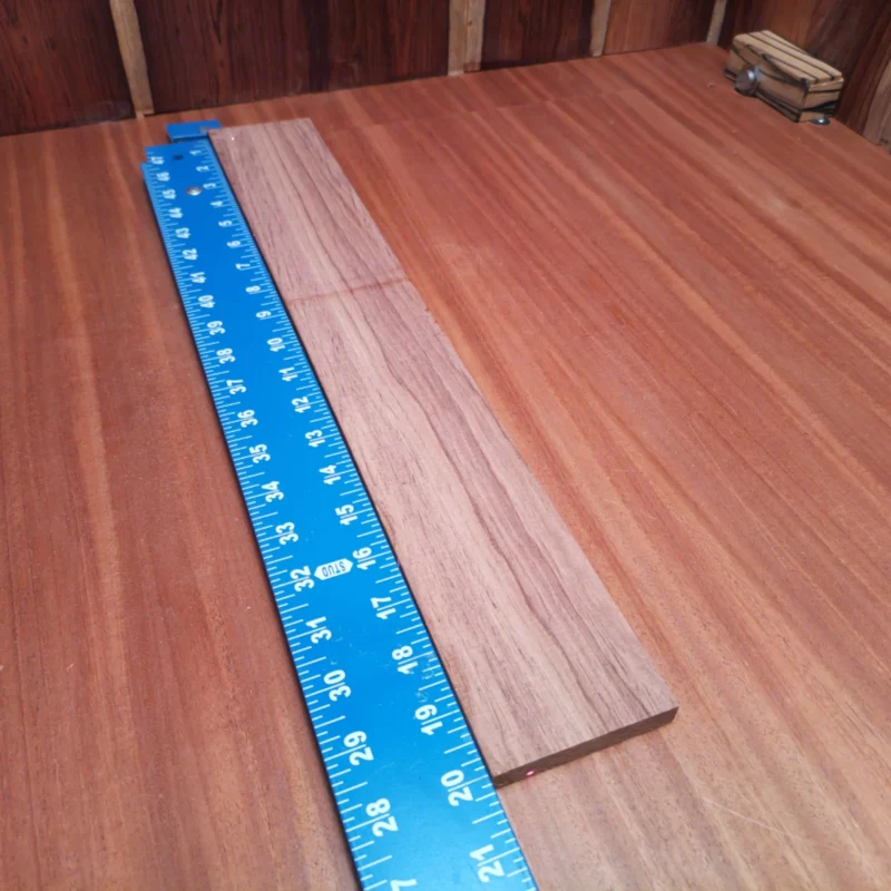 Elevate your luthiery with this premium Honduran Rosewood blank! Perfect for crafting stunning acoustic instruments, its rich tonality and visual allure will inspire creativity. Easy to work with, this blank is designed to resonate beautifully, delivering unmatched sound quality. Ideal for experienced luthiers and aspiring builders alike, you'll enjoy the smooth finish and versatility of this stunning wood. Get ready to transform your musical vision into reality! It is a Honduran Rosewood Acoustic Rift Sawn fingerboard blank with dimensions of 20.0 x 2.9 x 0.4 inches.