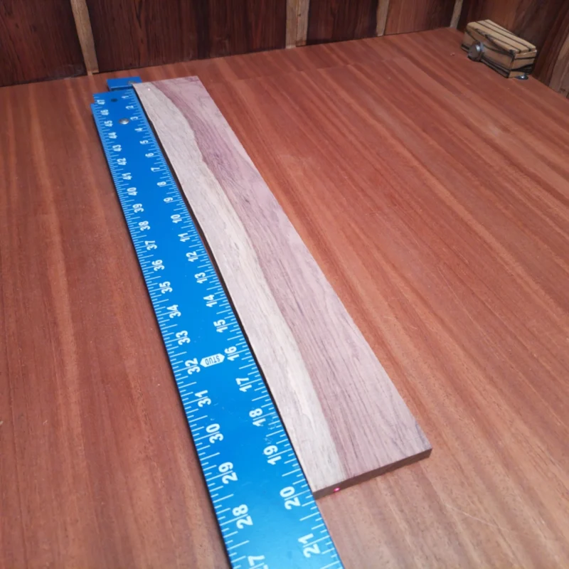 Discover the rich tones of this Honduran Rosewood fingerboard blank, perfect for luthiers seeking quality and durability. With its rift-sawn cut, this piece offers stunning visual appeal and superior sound transmission. Ideal for crafting acoustic instruments, this hardwood delivers a warm, resonant response that will enhance your project. Elevate your builds and let your creativity flourish with this lush wood choice that combines beauty and functionality. It is a Honduran Rosewood Acoustic Rift Sawn fingerboard blank with dimensions of 20.1 x 2.9 x 0.4 inches.