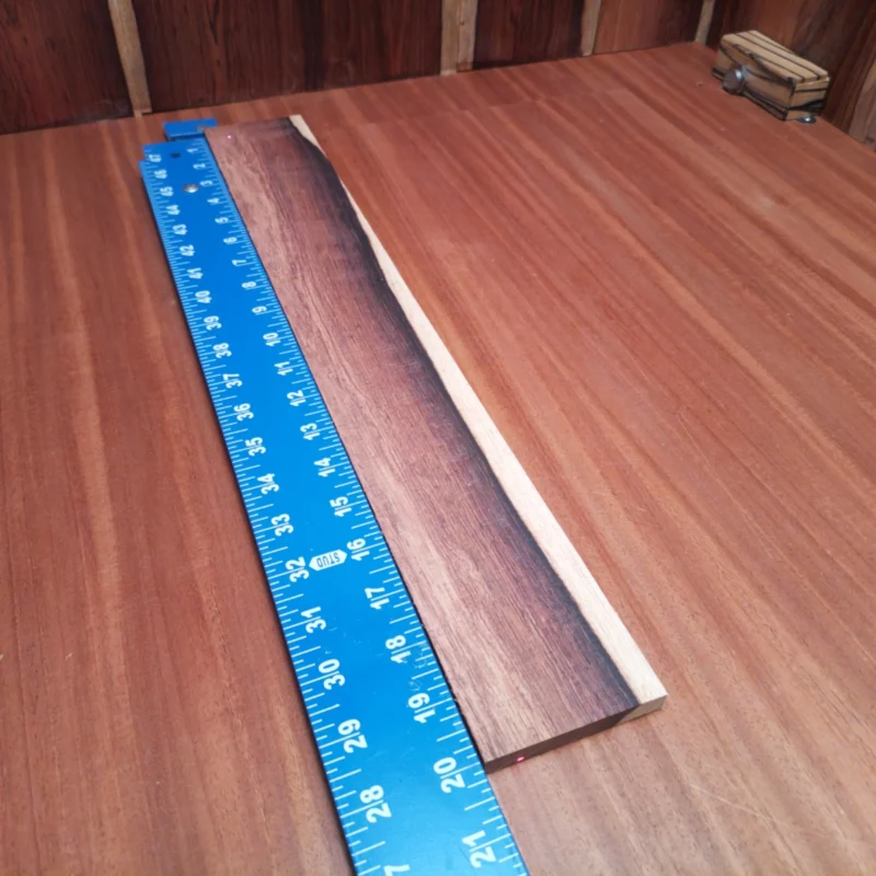 Fingerboard Blanks 146 Crafted from high-quality Honduran Rosewood, this acoustic fingerboard blank offers superior tonal properties. Its rich, dark grain provides striking aesthetics that enhance any luthier's project. Lightweight yet durable, this piece is perfect for creating beautiful, resonant instruments. Transform your designs with our versatile fingerboard blank and experience the satisfying blend of beauty and function. It is a Honduran Rosewood Acoustic Rift Sawn fingerboard blank with dimensions of 20.0 x 2.8 x 0.4 inches.