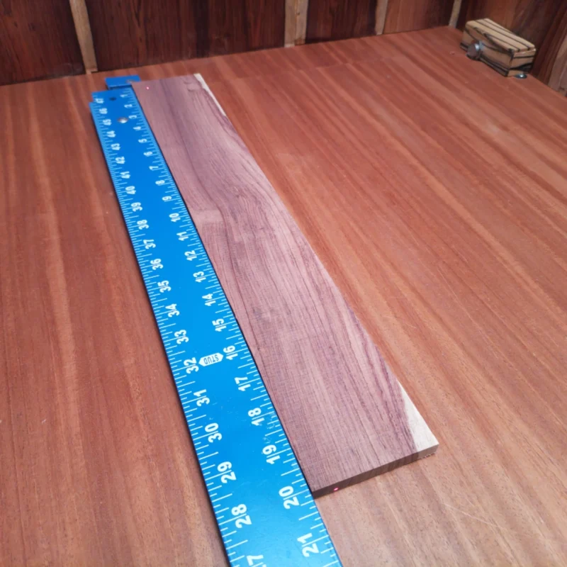 Take your acoustic projects to the next level with this Honduran Rosewood blank. Perfect for luthiers seeking superior tone and stunning aesthetics, its rich grain enhances both sound quality and visual appeal. Ideal for backs, sides, or fingerboards, this versatile wood delivers remarkable resonance. Elevate your craftsmanship and create an instrument that stands out on stage and in the studio! It is a Honduran Rosewood Acoustic Rift Sawn fingerboard blank with dimensions of 20.1 x 3.1 x 0.4 inches.