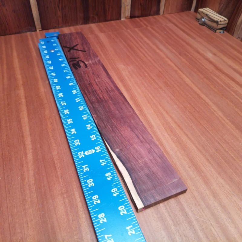 Dive into luthiery with our Honduran Rosewood fingerboard blank. This premium acoustic-grade rift sawn piece is ideal for crafting stunning fingerboards that resonate beautifully. With its rich tone and striking grain patterns, your instruments will not just sound amazing, but look fantastic too! Perfect for experienced luthiers or energetic enthusiasts looking to create their next masterpiece. It is a Honduran Rosewood Acoustic Rift Sawn fingerboard blank with dimensions of 20.2 x 2.5 x 0.4 inches.