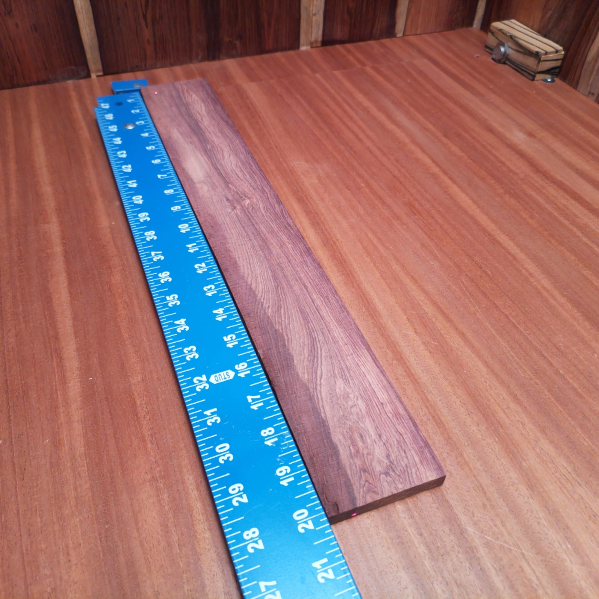 Honduran Rosewood Acoustic Rift Sawn Fingerboard Blank 0.4" X 2.8" X 20.2" - HRAFBR000302 1 Elevate your craft with our premium Honduran Rosewood Acoustic blank. Perfect for luthiers seeking durable, resonant materials, this blank delivers rich tonal depth. Its beautiful rift sawn grain not only provides stunning aesthetics but also ensures stability for your projects. Whether you’re building a guitar, ukulele, or another stringed instrument, this blank is designed to inspire creativity and produce exceptional sound quality. Transform your next acoustic masterpiece with this extraordinary wood. It is a Honduran Rosewood Acoustic Rift Sawn fingerboard blank with dimensions of 20.2 x 2.8 x 0.4 inches.