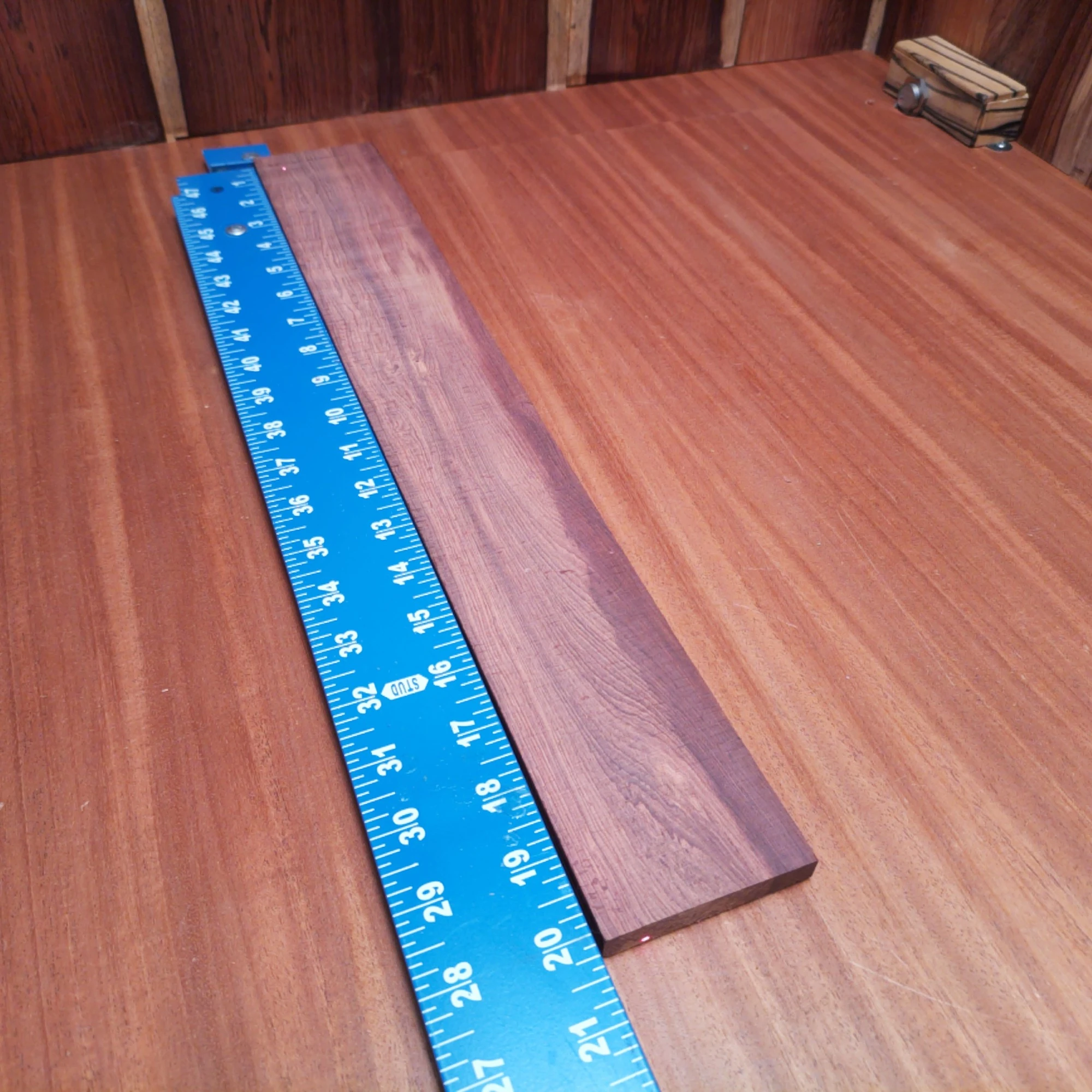 Honduran Rosewood Acoustic Rift Sawn Fingerboard Blank 0.4" X 2.8" X 20.2" - HRAFBR000302 2 Elevate your craft with our premium Honduran Rosewood Acoustic blank. Perfect for luthiers seeking durable, resonant materials, this blank delivers rich tonal depth. Its beautiful rift sawn grain not only provides stunning aesthetics but also ensures stability for your projects. Whether you’re building a guitar, ukulele, or another stringed instrument, this blank is designed to inspire creativity and produce exceptional sound quality. Transform your next acoustic masterpiece with this extraordinary wood. It is a Honduran Rosewood Acoustic Rift Sawn fingerboard blank with dimensions of 20.2 x 2.8 x 0.4 inches.