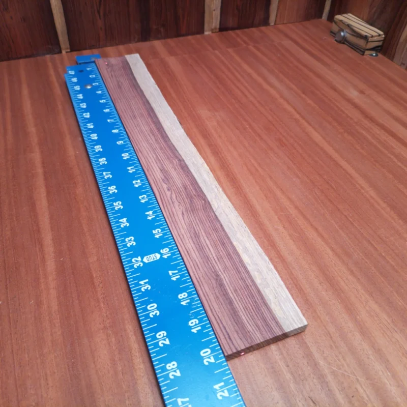Fingerboard Blanks 101 Craft your dream fingerboard with this premium Honduran Rosewood blank. Designed specifically for luthiers, its rift-sawn cut enhances tonal clarity and stability. The rich, warm tones of rosewood will elevate any build and truly impress. Elevate your craftsmanship today with this beautiful, high-quality material. It is a Honduran Rosewood Acoustic Rift Sawn fingerboard blank with dimensions of 20.1 x 2.7 x 0.4 inches.