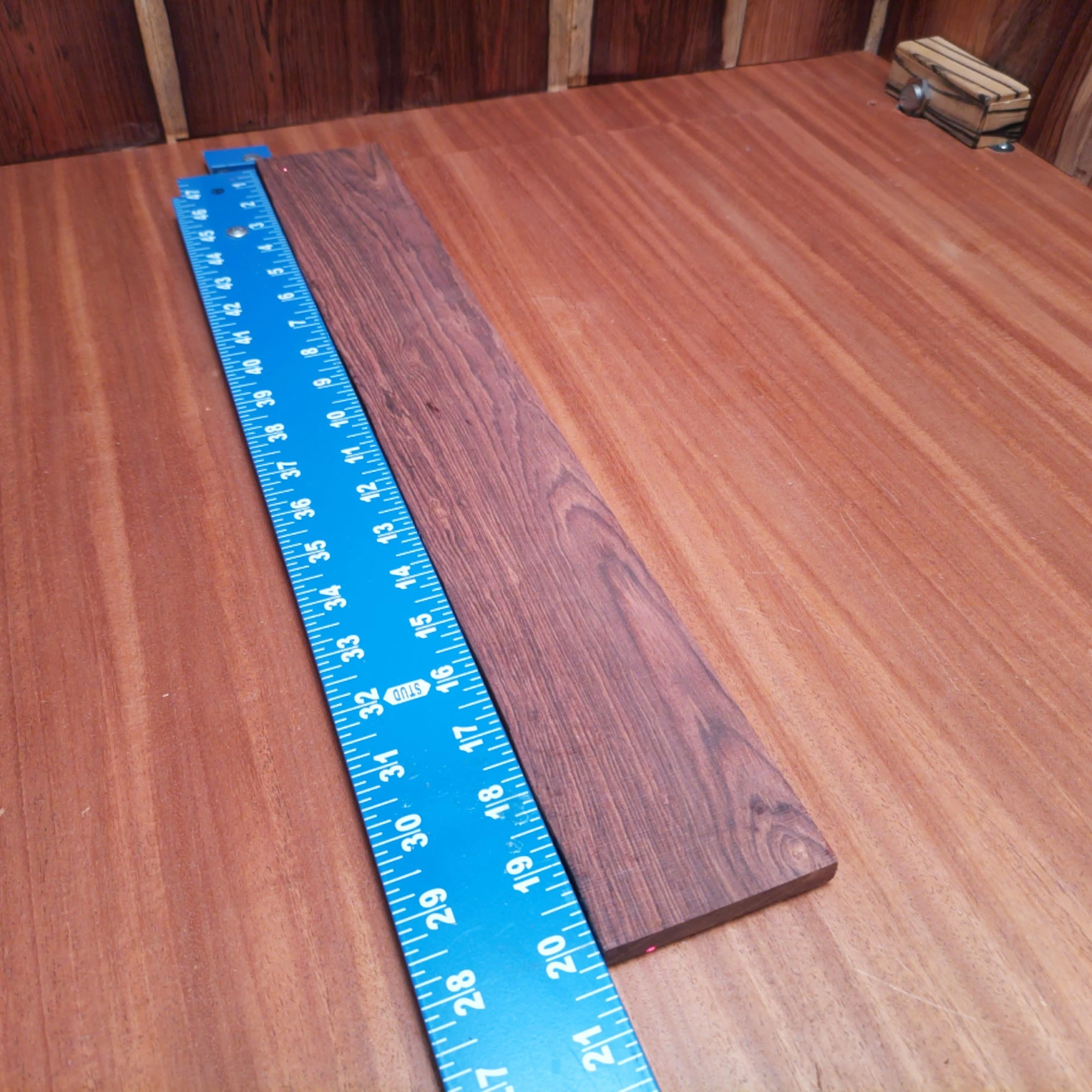 Honduran Rosewood Acoustic Rift Sawn Fingerboard Blank 0.4" X 2.9" X 20.1" - HRAFBR000305 1 Elevate your crafting with this Honduran Rosewood blank, perfect for luthiers seeking rich tonal quality. The fine rift sawn dimensions of 0.4" thick and 2.9" wide ensure easy handling and precision when sculpting your next masterpiece. Whether you’re constructing an acoustic or perfecting a custom design, this premium wood offers stunning aesthetics and durability to make your instrument stand out in sound and style. It is a Honduran Rosewood Acoustic Rift Sawn fingerboard blank with dimensions of 20.1 x 2.9 x 0.4 inches.