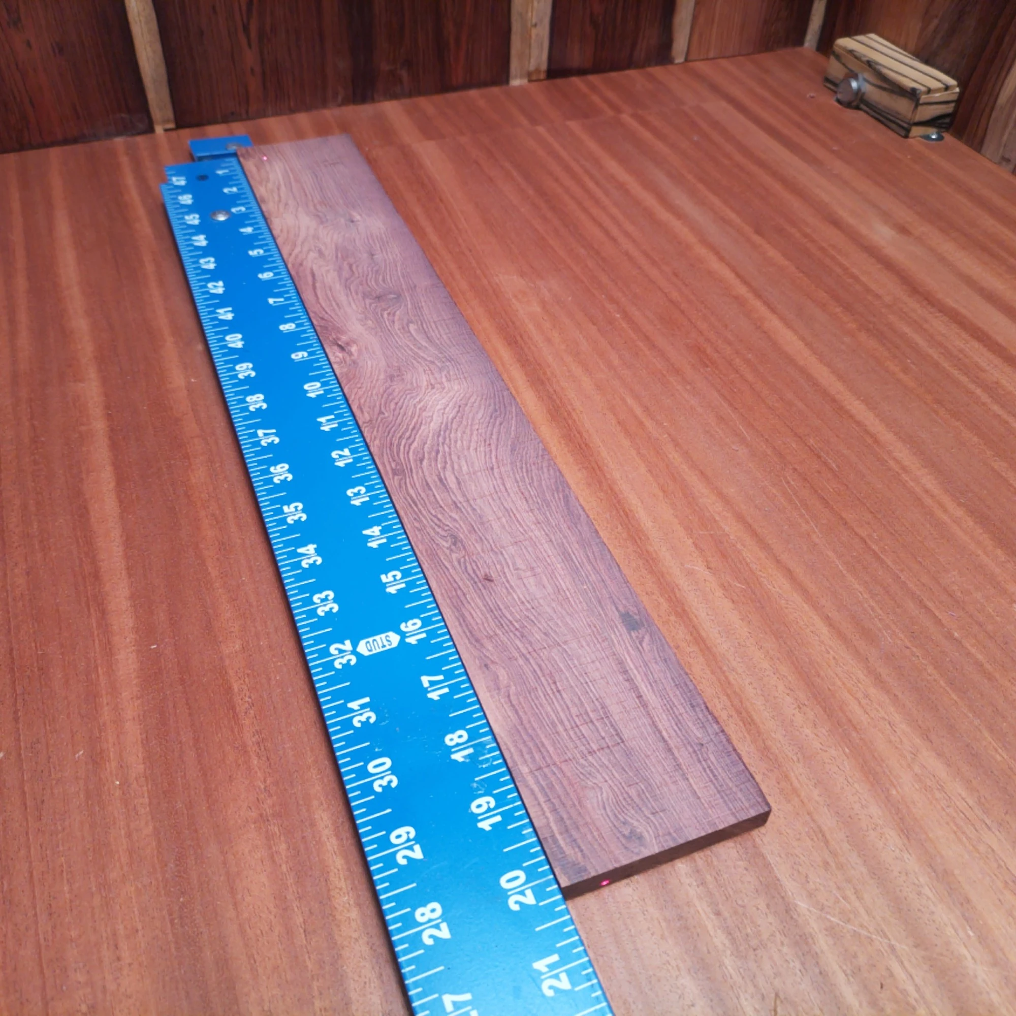 Honduran Rosewood Acoustic Rift Sawn Fingerboard Blank 0.4" X 2.9" X 20.1" - HRAFBR000308 1 Crafted from high-quality Honduran Rosewood, this fingerboards blank offers rich tonal properties ideal for any luthier. Its beautiful grain and rift sawn cut enhance both aesthetics and resonance in your guitars. Perfect for crafting custom fingerboards that musicians will love, this durable material ensures superior playability and sound clarity. It is a Honduran Rosewood Acoustic Rift Sawn fingerboard blank with dimensions of 20.1 x 2.9 x 0.4 inches.