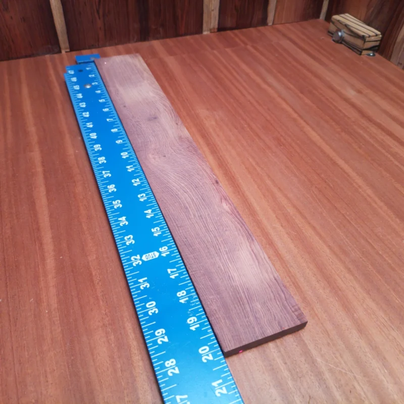 Honduran Rosewood Acoustic Rift Sawn Fingerboard Blank 0.4" X 2.9" X 20.1" - HRAFBR000308 3 Crafted from high-quality Honduran Rosewood, this fingerboards blank offers rich tonal properties ideal for any luthier. Its beautiful grain and rift sawn cut enhance both aesthetics and resonance in your guitars. Perfect for crafting custom fingerboards that musicians will love, this durable material ensures superior playability and sound clarity. It is a Honduran Rosewood Acoustic Rift Sawn fingerboard blank with dimensions of 20.1 x 2.9 x 0.4 inches.