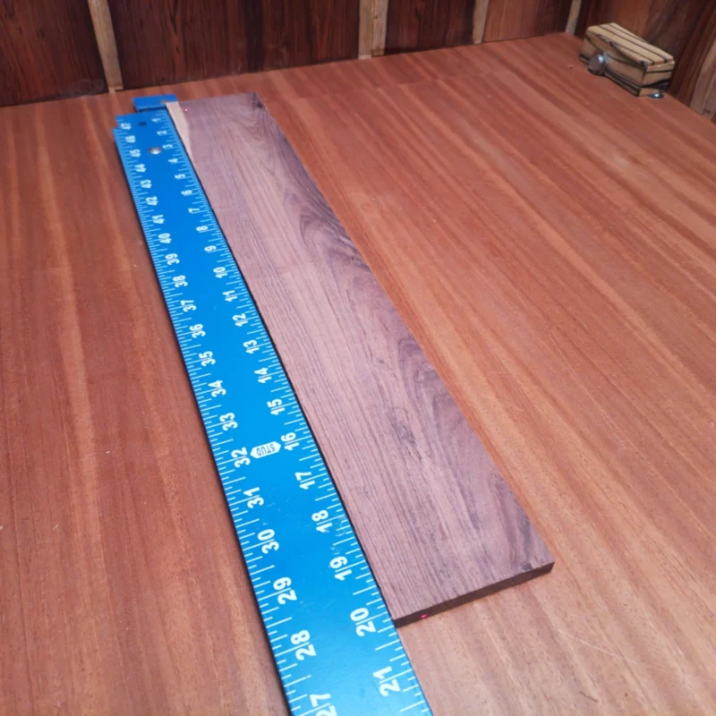 Honduran Rosewood Acoustic Rift Sawn Fingerboard Blank 0.4" X 3.3" X 20.2" - HRAFBR000310 3 Crafted from premium Honduran rosewood, this acoustic fingerboard blank brings a warm, rich tone perfect for luthiers. Its smooth rift-sawn finish enhances playability while adding an elegant touch to your instruments. Whether you're shaping a classic guitar or a unique model, this high-quality wood delivers durability and unmatched resonance. Prepare to elevate your builds with this standout piece in your workshop! It is a Honduran Rosewood Acoustic Rift Sawn fingerboard blank with dimensions of 20.2 x 3.3 x 0.4 inches.