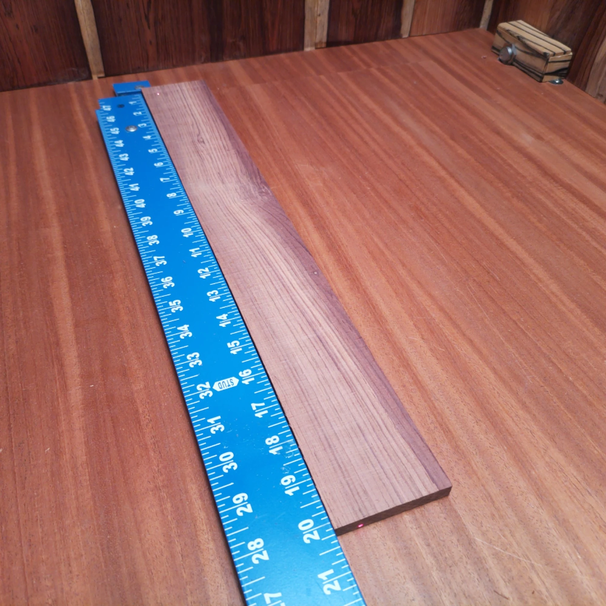 Honduran Rosewood Acoustic Rift Sawn Fingerboard Blank 0.4" X 2.7" X 20.1" - HRAFBR000312 1 Elevate your luthiery projects with our premium Honduran Rosewood fingerboard blank. This Rift Sawn beauty offers a stunning grain pattern and rich tones, perfect for crafting exquisite instruments. Its durability and resonance make it ideal for both professional and hobbyist luthiers looking to create exceptional acoustic guitars. Get ready to impress with a blank that not only looks great but enhances sound quality. It is a Honduran Rosewood Acoustic Rift Sawn fingerboard blank with dimensions of 20.1 x 2.7 x 0.4 inches.
