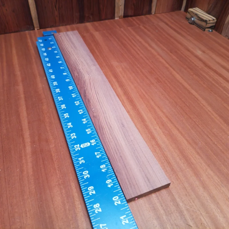 Honduran Rosewood Acoustic Rift Sawn Fingerboard Blank 0.4" X 2.7" X 20.1" - HRAFBR000312 3 Elevate your luthiery projects with our premium Honduran Rosewood fingerboard blank. This Rift Sawn beauty offers a stunning grain pattern and rich tones, perfect for crafting exquisite instruments. Its durability and resonance make it ideal for both professional and hobbyist luthiers looking to create exceptional acoustic guitars. Get ready to impress with a blank that not only looks great but enhances sound quality. It is a Honduran Rosewood Acoustic Rift Sawn fingerboard blank with dimensions of 20.1 x 2.7 x 0.4 inches.