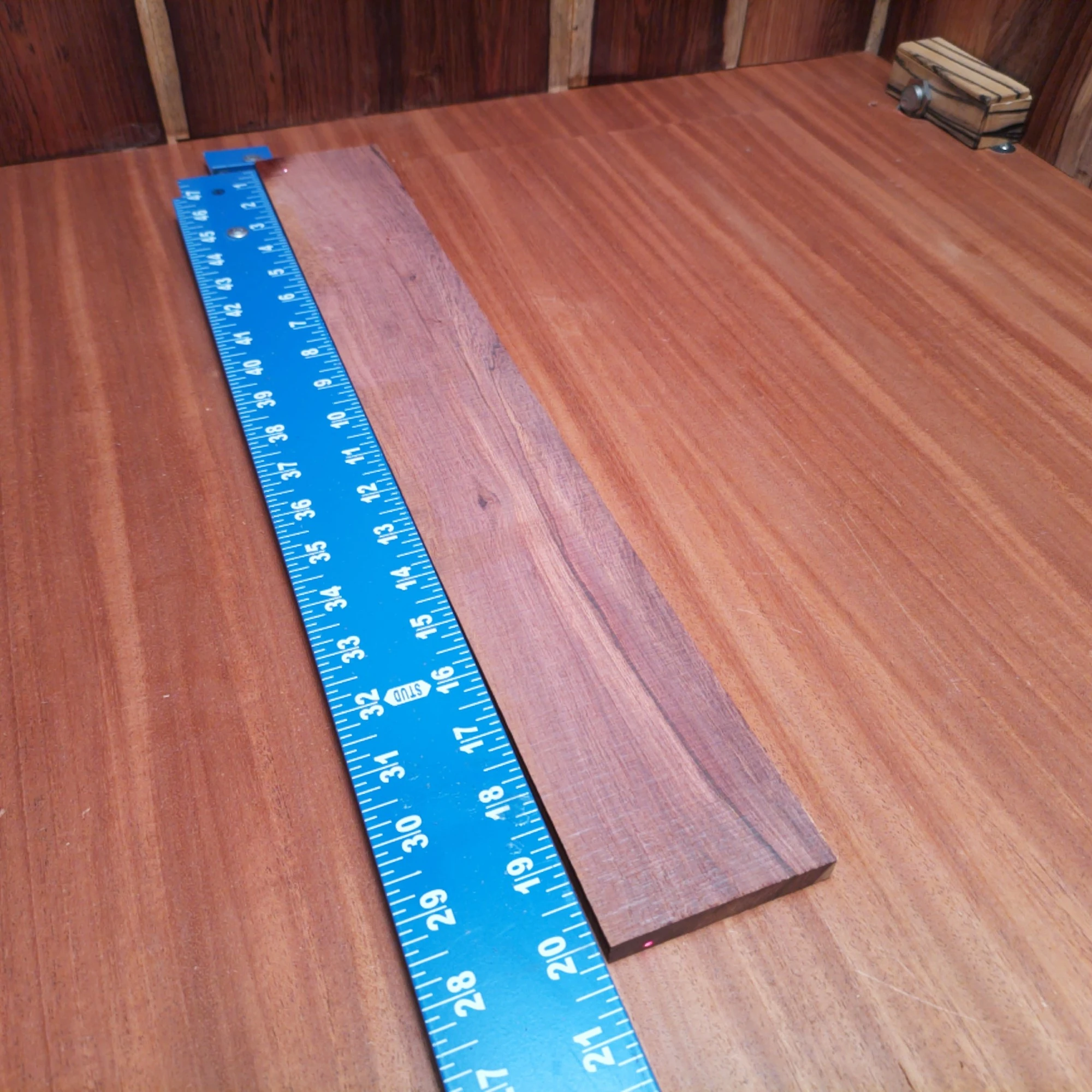 Honduran Rosewood Acoustic Rift Sawn Fingerboard Blank 0.4" X 2.9" X 20.1" - HRAFBR000316 1 Crafted from premium Honduran rosewood, this fingerboards blank promises superior tonal quality and beautiful aesthetics. Perfect for luthiers seeking a reliable material for their next acoustic project, it's dimensionally precise and ready for your creativity. Unleash your craftsmanship with this versatile blank, ideal for solid builds and nuanced sound. Transform your designs and elevate your music with unparalleled warmth and resonance! It is a Honduran Rosewood Acoustic Rift Sawn fingerboard blank with dimensions of 20.1 x 2.9 x 0.4 inches.