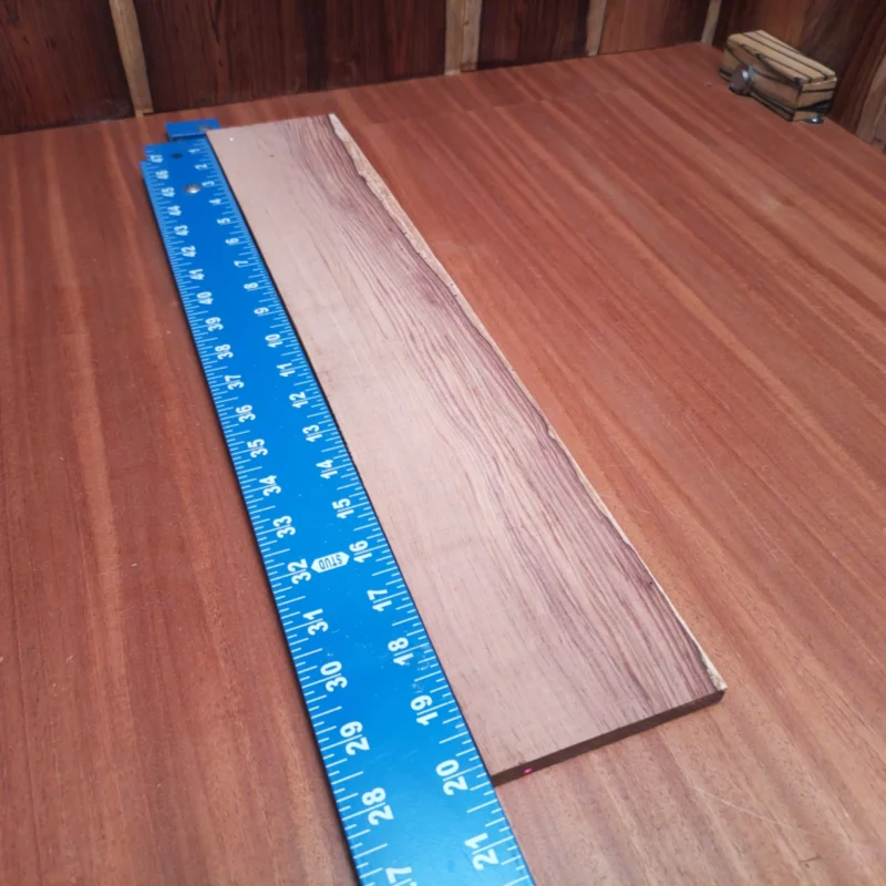 Craft your masterpiece with this Honduran Rosewood fingerboards blank, perfect for luthiers seeking quality. Its dense grain offers warm tones, enhancing sound projection and resonance. Built for durability and beauty, this blank allows for intricate designs and smooth playability. Elevate your instrument craftsmanship with a material that speaks versatility and elegance. Your next guitar project deserves the best foundation! It is a Honduran Rosewood Acoustic Rift Sawn fingerboard blank with dimensions of 20.1 x 3.8 x 0.4 inches.