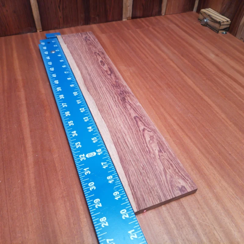 Unleash your creativity with this Honduran Rosewood acoustic fingerboard blank. Known for its rich tonal qualities and stunning visual appeal, this rift sawn wood is perfect for luthiers looking to craft exceptional instruments. Its durability and smooth finish promise a pleasant playing experience and resonant sound. Elevate your next project and impress musicians with this high-quality fingerboard material that's made for serious craftsmanship. It is a Honduran Rosewood Acoustic Rift Sawn fingerboard blank with dimensions of 20.1 x 3.7 x 0.4 inches.