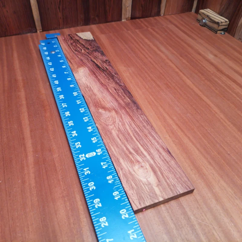 Elevate your guitar projects with this beautiful Honduran Rosewood blank. Perfect for luthiers, its rich tonal qualities and striking grain will add character to any acoustic instrument. This rift sawn piece is ideal for crafting sides, backs, or even unique fingerboards. Blend functionality with artistry as you create an instrument that sounds as good as it looks! It is a Honduran Rosewood Acoustic Rift Sawn fingerboard blank with dimensions of 20.1 x 3.5 x 0.4 inches.