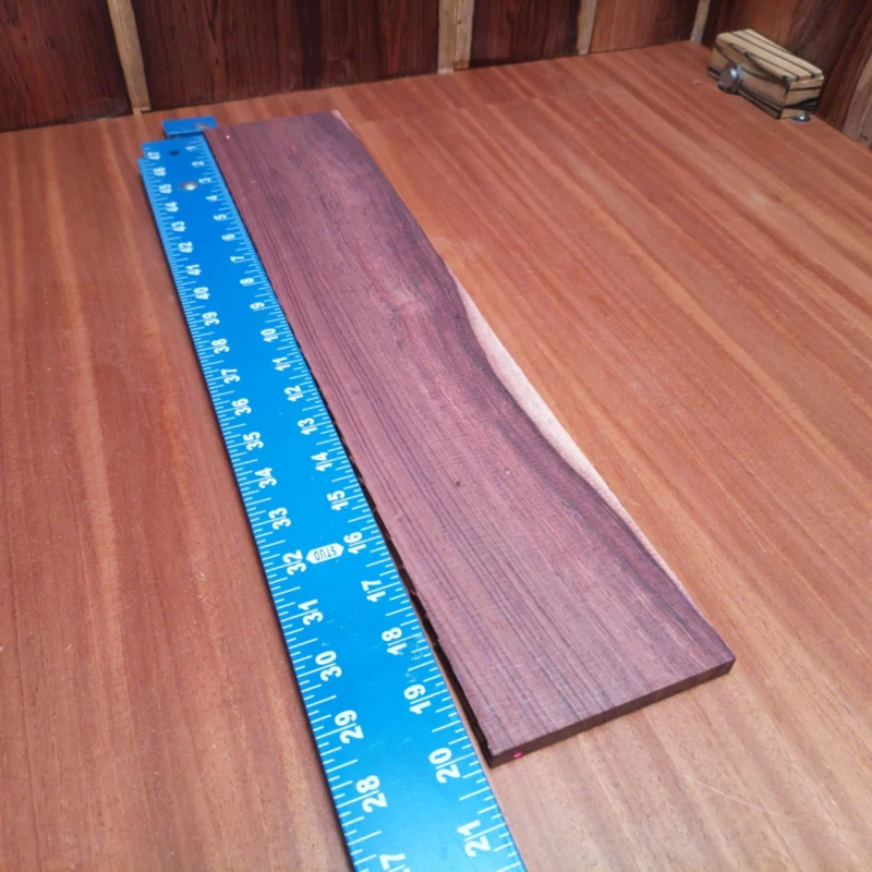 Elevate your luthier skills with our Honduran Rosewood blank, designed for crafting stunning acoustic instruments. This high-quality, rift sawn wood offers superior tonal qualities and stability, making it perfect for any serious builder. Rich, vibrant hues and a fine, straight grain ensure your creations will not only sound fantastic but also look amazing. Engage your creativity and create beautiful guitars with this high-grade material. It is a Honduran Rosewood Acoustic Rift Sawn fingerboard blank with dimensions of 20.1 x 4.0 x 0.4 inches.