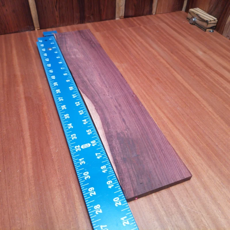 Elevate your luthier skills with our Honduran Rosewood blank, designed for crafting stunning acoustic instruments. This high-quality, rift sawn wood offers superior tonal qualities and stability, making it perfect for any serious builder. Rich, vibrant hues and a fine, straight grain ensure your creations will not only sound fantastic but also look amazing. Engage your creativity and create beautiful guitars with this high-grade material. It is a Honduran Rosewood Acoustic Rift Sawn fingerboard blank with dimensions of 20.1 x 4.0 x 0.4 inches.