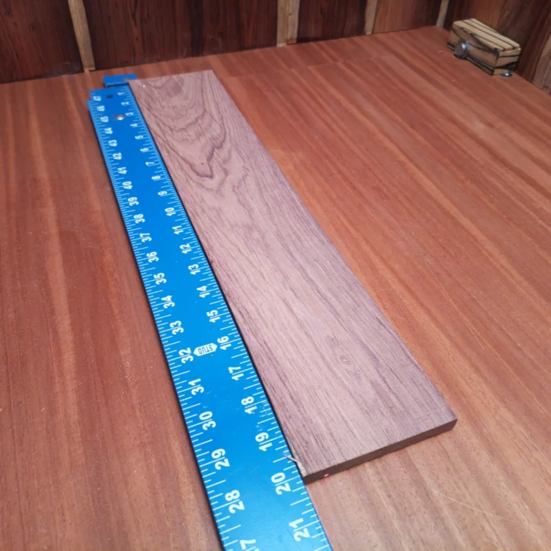 Honduran Rosewood Acoustic Rift Sawn Fingerboard Blank 0.4" X 4.0" X 20.1" - HRAFBR000337 3 Unlock your creativity with our premium Honduran Rosewood fingerboards blank, designed specifically for luthiers. Its stunning grain patterns promise both beauty and quality in every strum. Perfect for crafting acoustic instruments, this rift-sawn rosewood offers a rich tone that enhances playability, ensuring your next guitar or ukulele stands out in both sound and style. Transform your musical vision with this versatile and durable material! It is a Honduran Rosewood Acoustic Rift Sawn fingerboard blank with dimensions of 20.1 x 4.0 x 0.4 inches.