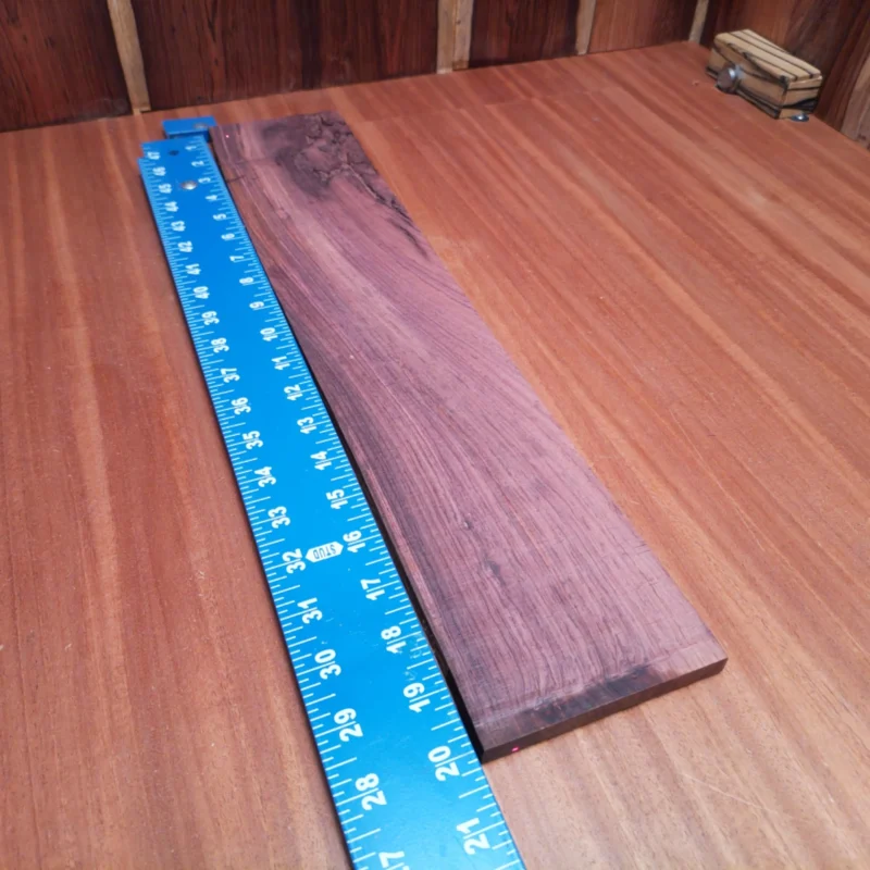 Unlock the potential of your next acoustic project with our Honduran Rosewood blank. This premium rift-sawn wood promises superior tonal quality, ensuring vibrant resonance in your instrument. Its rich, dark grains offer stunning aesthetic appeal, making every piece a conversation starter. Perfect for luthiers seeking quality materials that combine beauty and functionality, this blank is a must-have for crafting your next masterpiece. It is a Honduran Rosewood Acoustic Rift Sawn fingerboard blank with dimensions of 20.1 x 4.0 x 0.4 inches.
