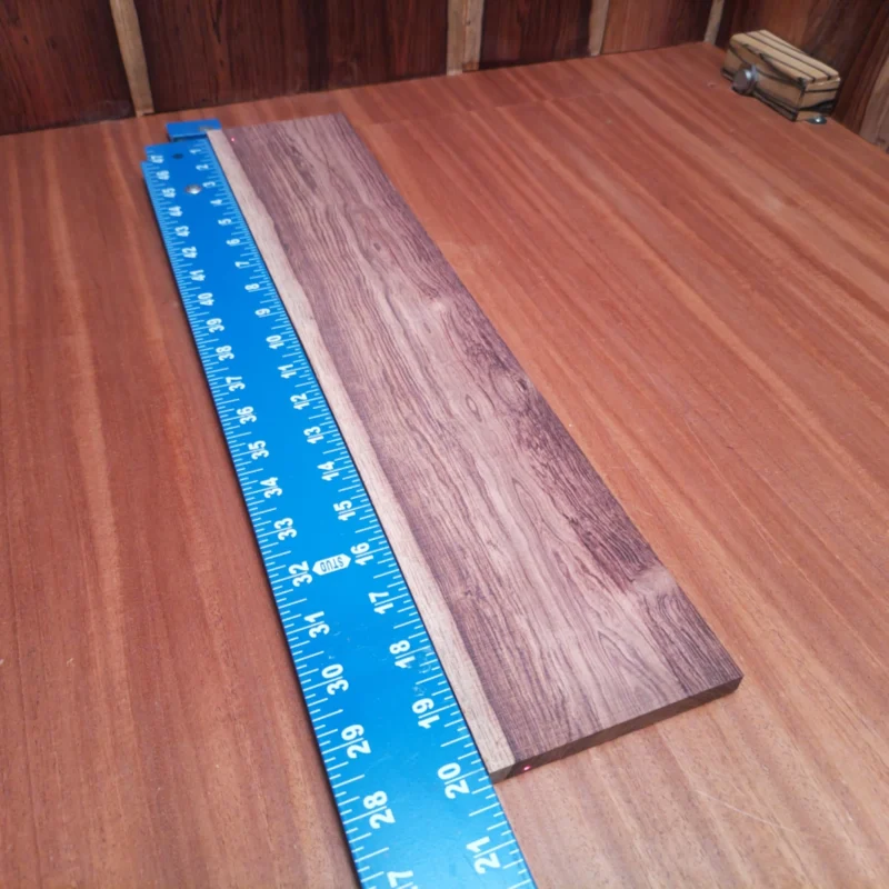 Experience the rich tones and stunning aesthetics of this Honduran Rosewood fingerboard blank. Perfect for luthiers, this premium material is known for its durability, beautiful grain patterns, and harmonic resonance. Whether you're crafting a new acoustic masterpiece or upgrading an existing instrument, this fingerboard blank will elevate your craft and deliver a sound that's both warm and vibrant. Grab yours now to unleash creativity on your next project! It is a Honduran Rosewood Acoustic Rift Sawn fingerboard blank with dimensions of 20.1 x 4.0 x 0.4 inches.