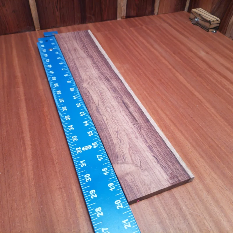 Experience the rich tones and stunning aesthetics of this Honduran Rosewood fingerboard blank. Perfect for luthiers, this premium material is known for its durability, beautiful grain patterns, and harmonic resonance. Whether you're crafting a new acoustic masterpiece or upgrading an existing instrument, this fingerboard blank will elevate your craft and deliver a sound that's both warm and vibrant. Grab yours now to unleash creativity on your next project! It is a Honduran Rosewood Acoustic Rift Sawn fingerboard blank with dimensions of 20.1 x 4.0 x 0.4 inches.