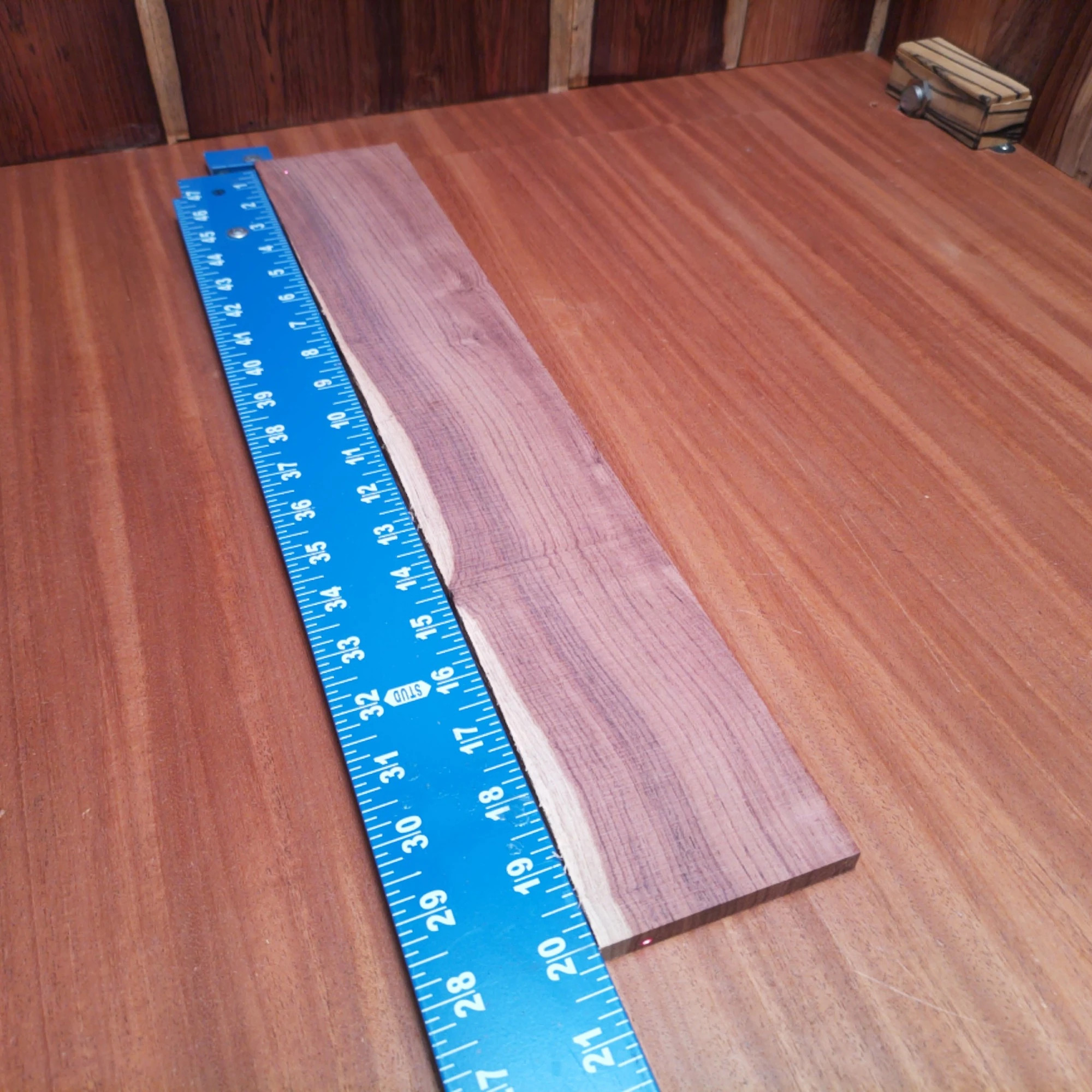 Honduran Rosewood Acoustic Rift Sawn Fingerboard Blank 0.4" X 3.4" X 20.1" - HRAFBR000345 2 Unlock your creativity with this premium Honduran Rosewood blank, perfect for crafting the ultimate acoustic instruments. Its rich color and resonant properties make it a favorite among luthiers for custom builds. Explore new soundscapes and enhance your guitar's tone with this high-quality material. Whether you're a seasoned luthier or a passionate hobbyist, this wood will take your projects to the next level. Get ready to impress with superior craftsmanship and breathtaking sound! It is a Honduran Rosewood Acoustic Rift Sawn fingerboard blank with dimensions of 20.1 x 3.4 x 0.4 inches.