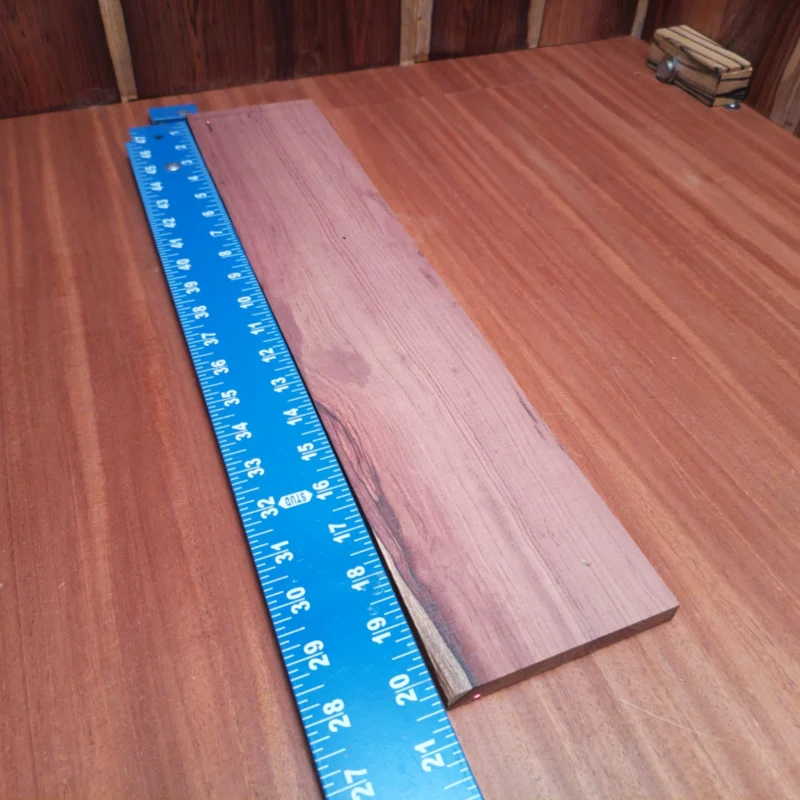Honduran Rosewood Acoustic Rift Sawn Fingerboard Blank 0.4" X 4.1" X 20.3" - HRAFBR000346 3 Unlock the potential of your next acoustic project with this premium Honduran Rosewood blank. Offering stunning tonal qualities and a beautiful grain, this rift sawn wood is perfect for luthiers seeking durability and richness of sound. The ideal dimensions make it easy to work with, ensuring your fingerboards will shine. Craft with confidence and let your creativity soar! It is a Honduran Rosewood Acoustic Rift Sawn fingerboard blank with dimensions of 20.3 x 4.1 x 0.4 inches.