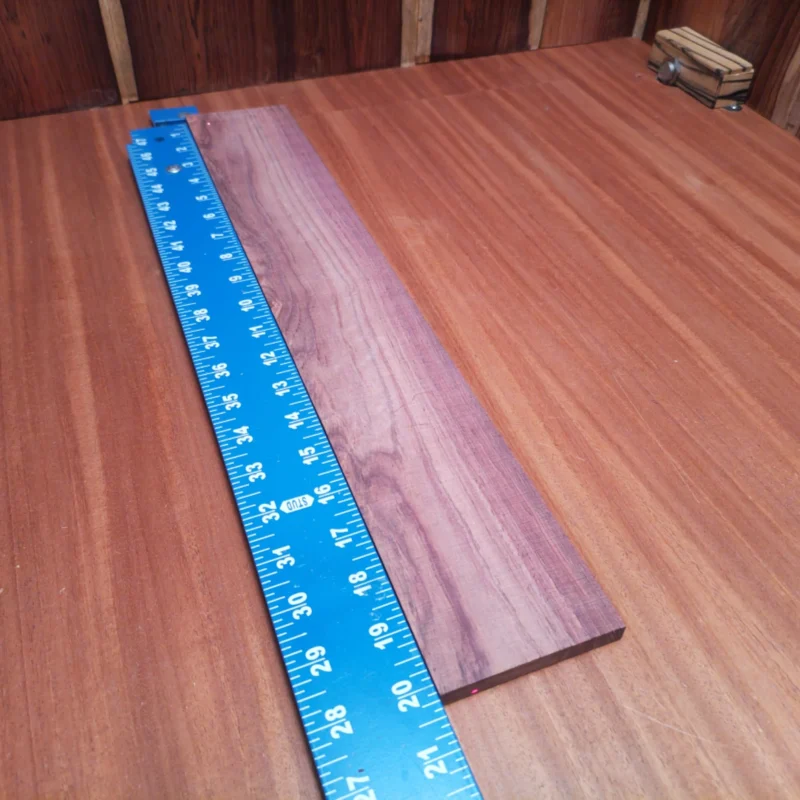 Unlock your creative potential with this premium Honduran Rosewood fingerboard blank. Perfect for crafting exquisite acoustics, its dense grain brings a rich sound and stunning appearance to your projects. Its generous size provides ample material for luthiers seeking both beauty and durability. Upgrade your guitar-making game and resonate with quality! It is a Honduran Rosewood Acoustic Rift Sawn fingerboard blank with dimensions of 20.2 x 3.1 x 0.4 inches.