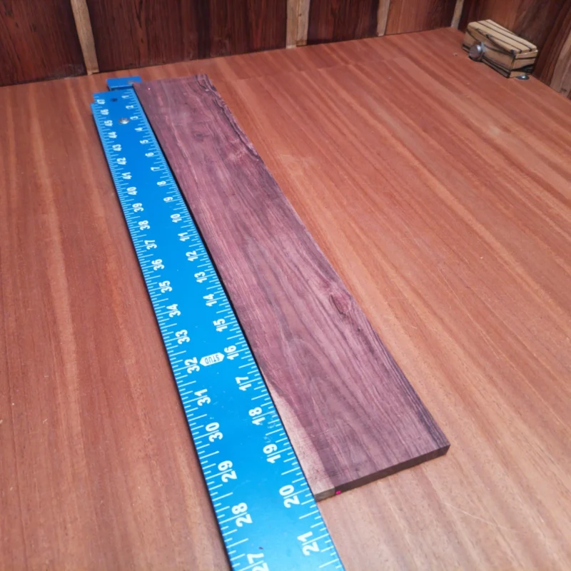 Honduran Rosewood Acoustic Rift Sawn Fingerboard Blank 0.4" X 3.4" X 20.2" - HRAFBR000355 3 Discover the rich tones and vibrant character of our Honduran Rosewood blanks. Perfect for luthiers looking to create impressive acoustic instruments, this rift-sawn piece offers both durability and stunning aesthetics. Whether shaping it into a guitar body or intricate details, this versatile wood is sure to deliver exceptional sound quality and playability. Elevate your craft with this wood, where beauty meets functionality! It is a Honduran Rosewood Acoustic Rift Sawn fingerboard blank with dimensions of 20.2 x 3.4 x 0.4 inches.