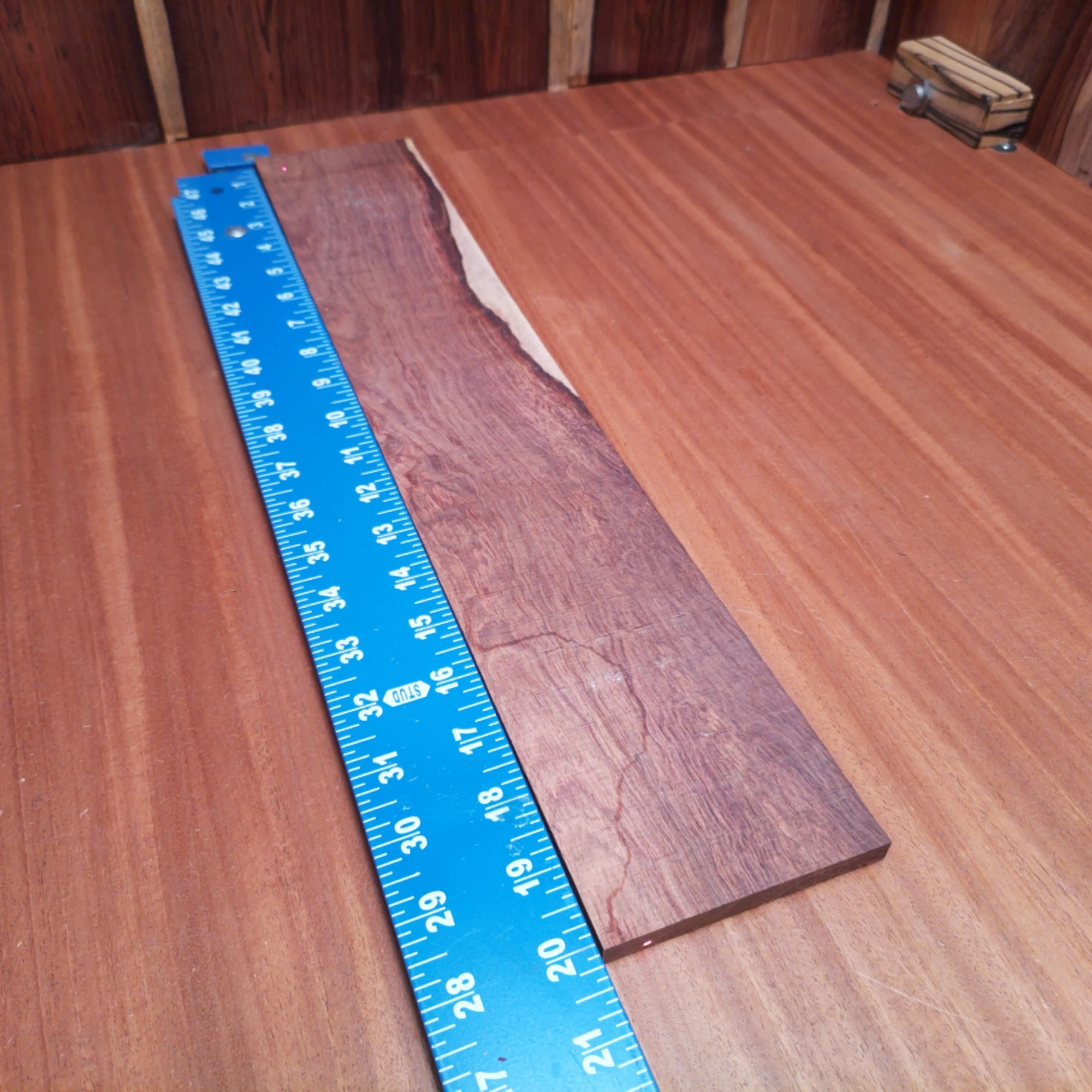 Honduran Rosewood Acoustic Rift Sawn Fingerboard Blank 0.4" X 3.7" X 20.1" - HRAFBR000356 2 Unlock your creativity with this premium Honduran Rosewood blank, crafted specifically for luthiers. Its rift-sawn grain pattern ensures stunning aesthetics while providing excellent tonal qualities. Ideal for creating beautiful acoustic instruments, this versatile blank helps you achieve that perfect sound with ease, all while adding a touch of elegance to your projects. Get ready to elevate your craftsmanship with this exceptional wood choice! It is a Honduran Rosewood Acoustic Rift Sawn fingerboard blank with dimensions of 20.1 x 3.7 x 0.4 inches.