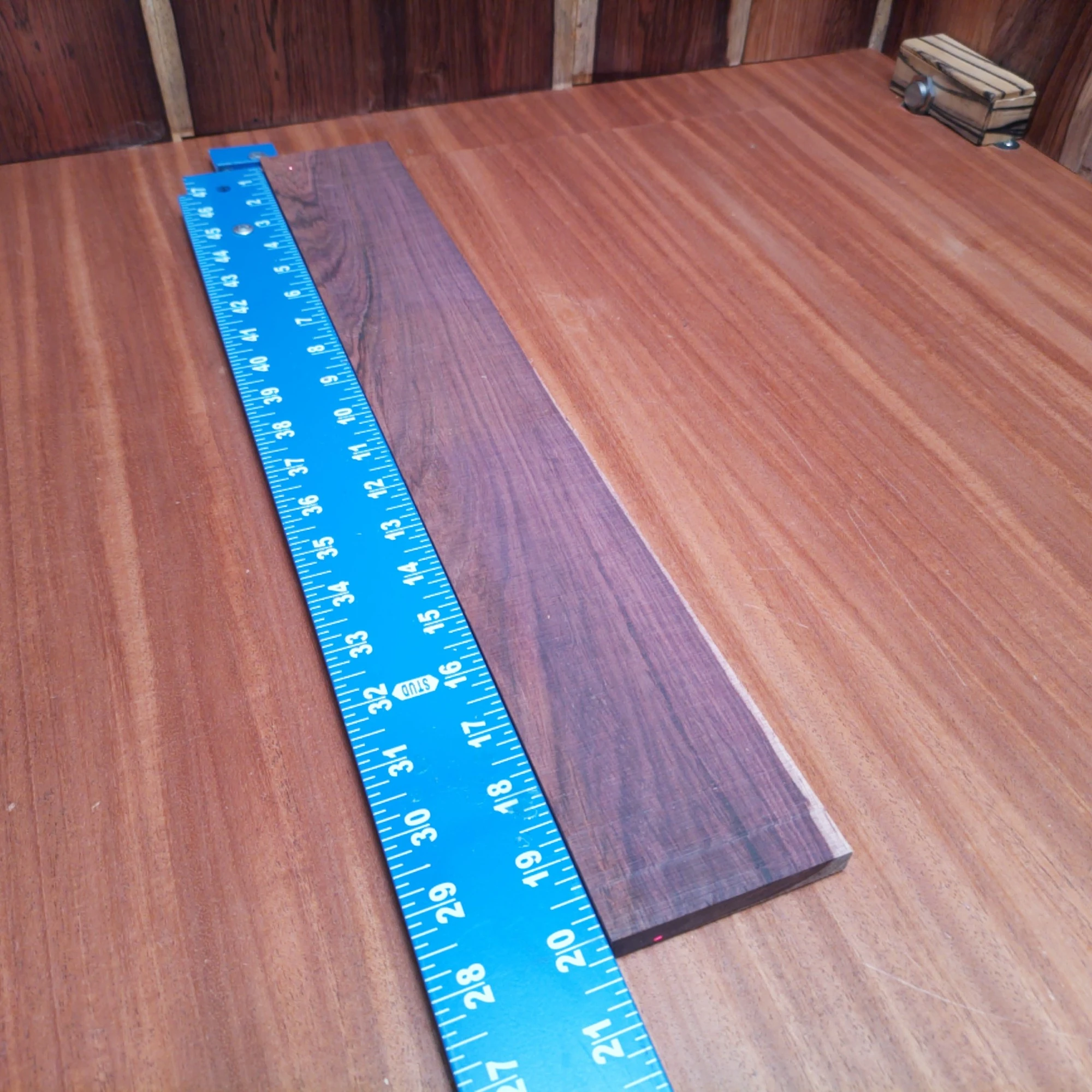 Honduran Rosewood Acoustic Rift Sawn Fingerboard Blank 0.4" X 3.0" X 20.1" - HRAFBR000362 1 Elevate your acoustic builds with our premium Honduran Rosewood fingerboard blank. Perfectly rift-sawn to minimize grain irregularities, this stunning wood not only looks great but enhances playability. Its rich color and tonal qualities make it a fantastic choice for luthiers seeking a combination of beauty and sound. Get ready to create masterpieces that resonate with quality and craftsmanship! It is a Honduran Rosewood Acoustic Rift Sawn fingerboard blank with dimensions of 20.1 x 3.0 x 0.4 inches.
