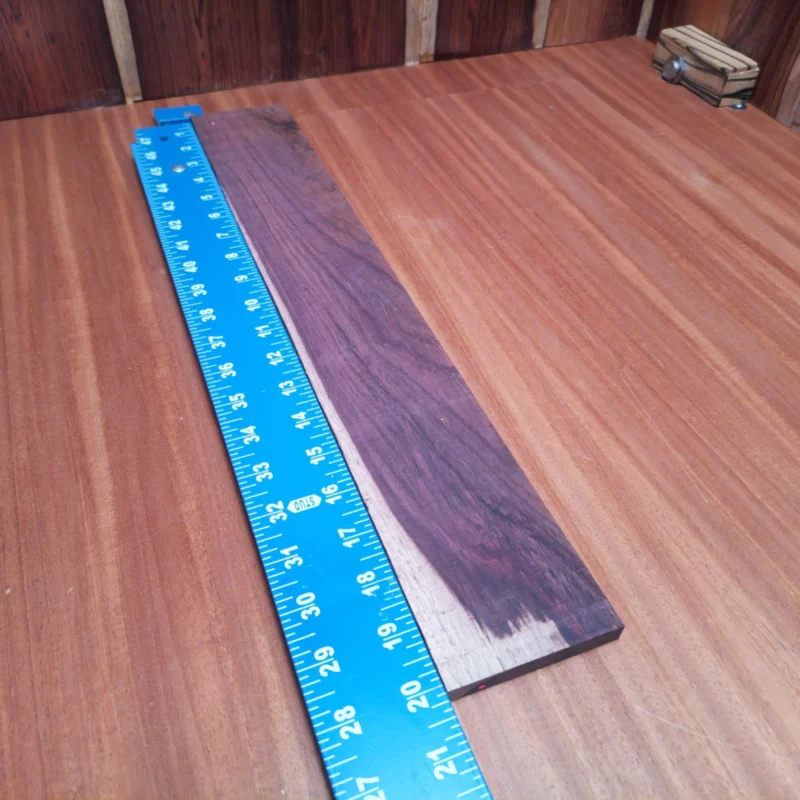 Honduran Rosewood Acoustic Rift Sawn Fingerboard Blank 0.4" X 3.0" X 20.1" - HRAFBR000362 3 Elevate your acoustic builds with our premium Honduran Rosewood fingerboard blank. Perfectly rift-sawn to minimize grain irregularities, this stunning wood not only looks great but enhances playability. Its rich color and tonal qualities make it a fantastic choice for luthiers seeking a combination of beauty and sound. Get ready to create masterpieces that resonate with quality and craftsmanship! It is a Honduran Rosewood Acoustic Rift Sawn fingerboard blank with dimensions of 20.1 x 3.0 x 0.4 inches.