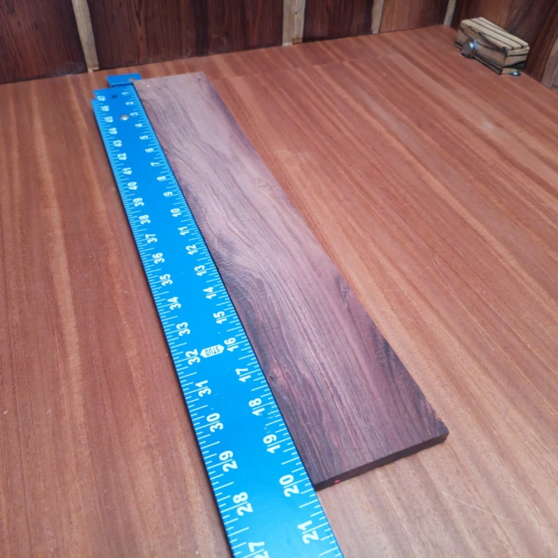 Honduran Rosewood Acoustic Rift Sawn Fingerboard Blank 0.4" X 3.3" X 20.1" - HRAFBR000366 3 Crafted for luthiers, this Honduran Rosewood blank brings stunning aesthetics and sonic richness to your instruments. With its beautiful grain and durability, it's perfect for crafting acoustic masterpieces. Elevate your creations with this high-quality wood that promises both performance and style. Ideal for experienced luthiers and novices alike, make each note resonate with warmth and clarity! It is a Honduran Rosewood Acoustic Rift Sawn fingerboard blank with dimensions of 20.1 x 3.3 x 0.4 inches.